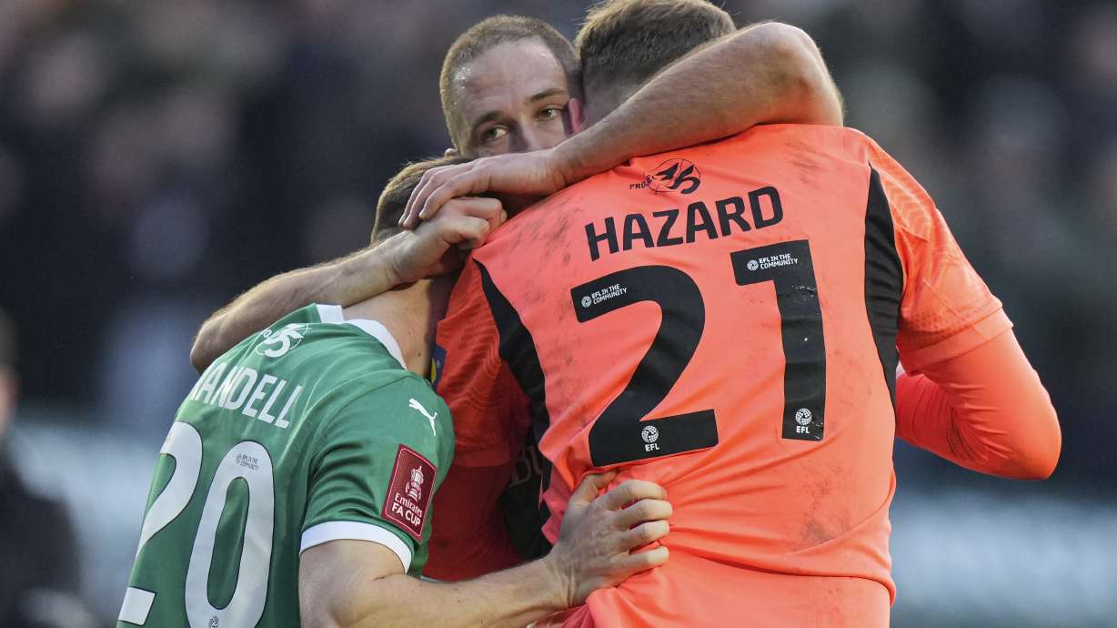 Plymouth's players celebrate after the English FA Cup fourth round soccer match between Plymouth Argyle and Liverpool at Home Park stadium in Plymouth, England, Sunday, Feb. 9, 2025.