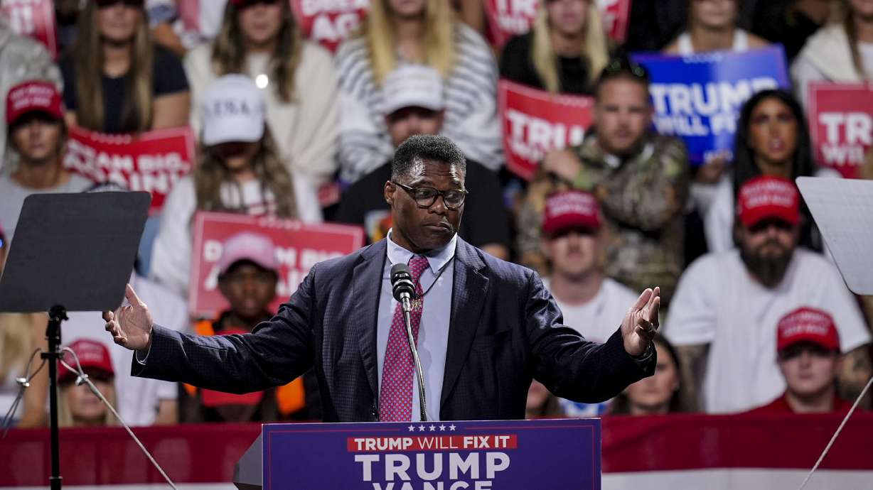 FILE - Herschel Walker speaks during a campaign rally at Atrium Health Amphitheater for Republican presidential nominee former President Donald Trump, Nov. 3, 2024, in Macon, Ga.