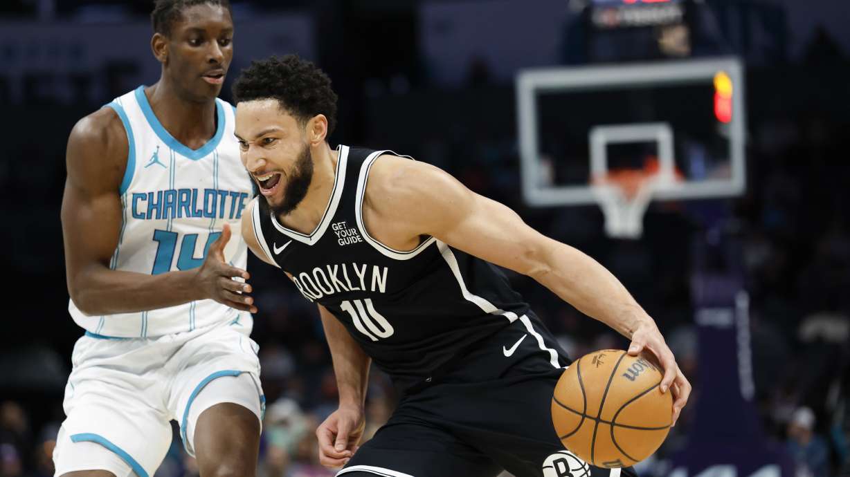 Brooklyn Nets guard Ben Simmons, right, drives past Charlotte Hornets forward Moussa Diabate during the second half of an NBA basketball game in Charlotte, N.C., Wednesday, Jan. 29, 2025.