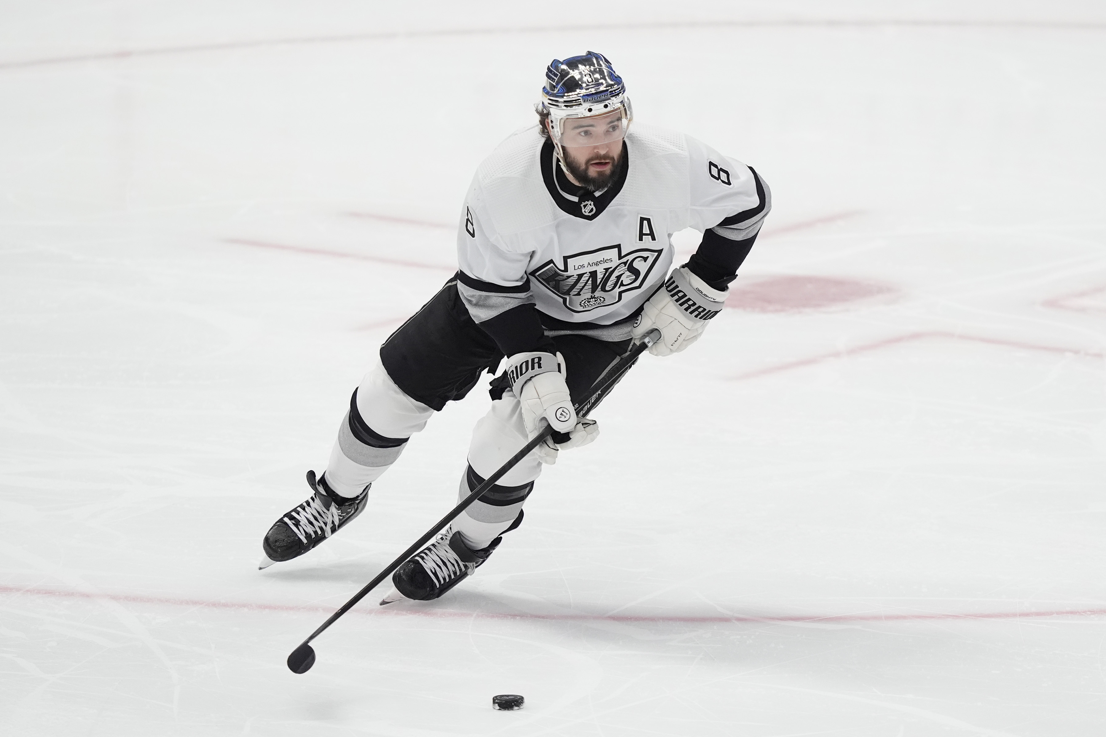 FILE - Los Angeles Kings defenseman Drew Doughty (8) skates with the puck during the first period an NHL hockey game against the Dallas Stars in Dallas, March 16, 2024.