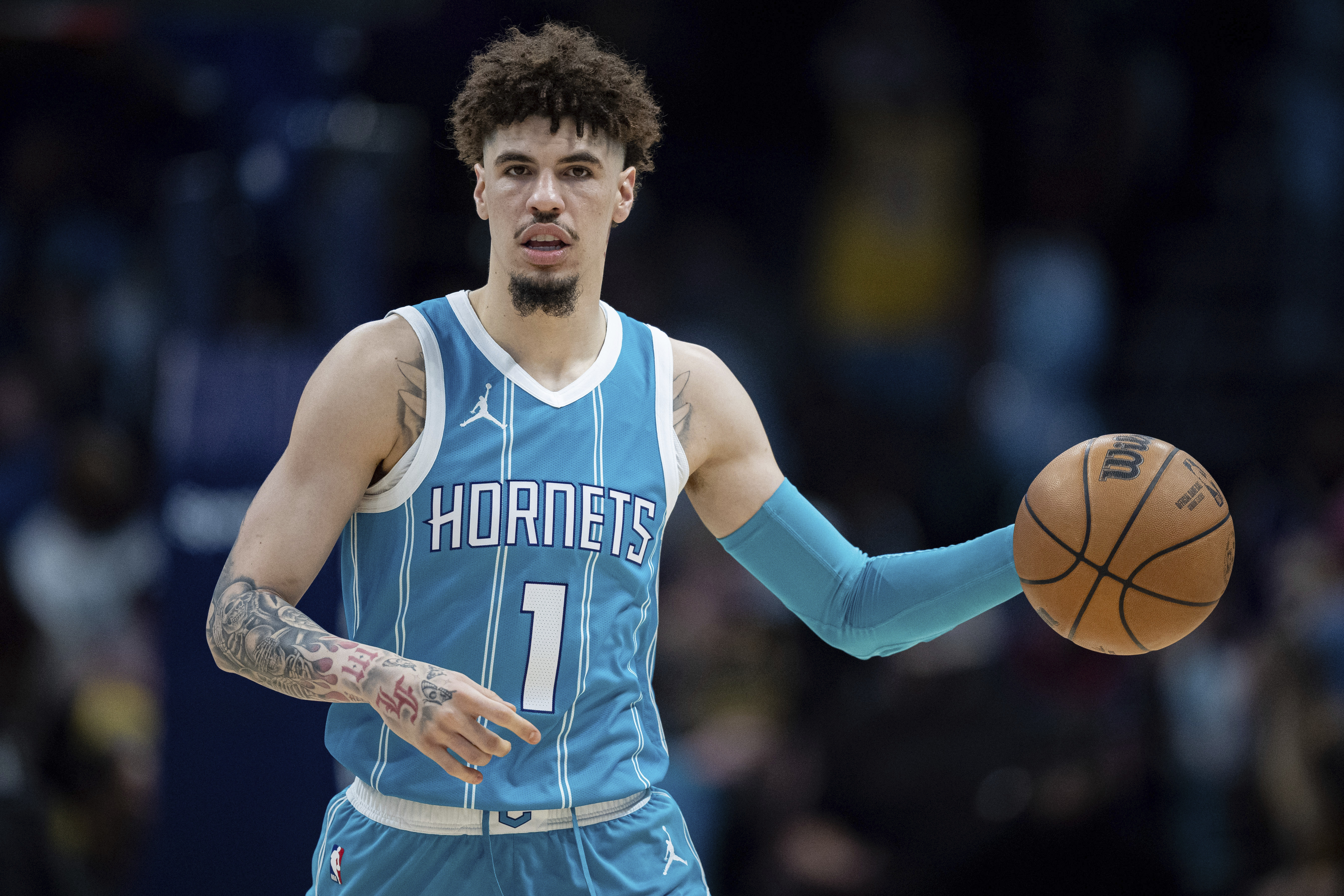 Charlotte Hornets guard LaMelo Ball brings the ball upcourt during the first half of an NBA basketball game against the Los Angeles Lakers, Monday, Jan. 27, 2025, in Charlotte, N.C.