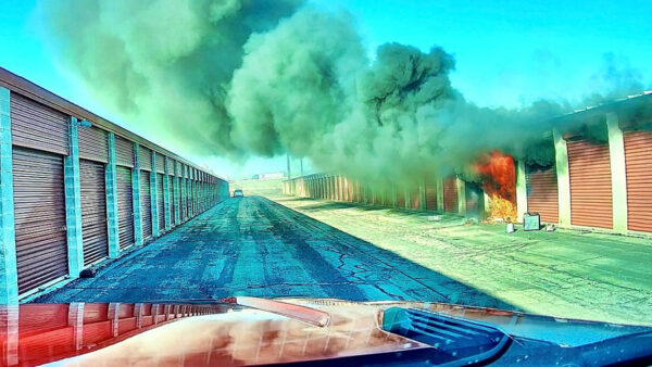 Weber firefighters narrowly beat passing train to fight storage unit fire