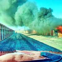 Weber firefighters narrowly beat passing train to fight storage unit fire