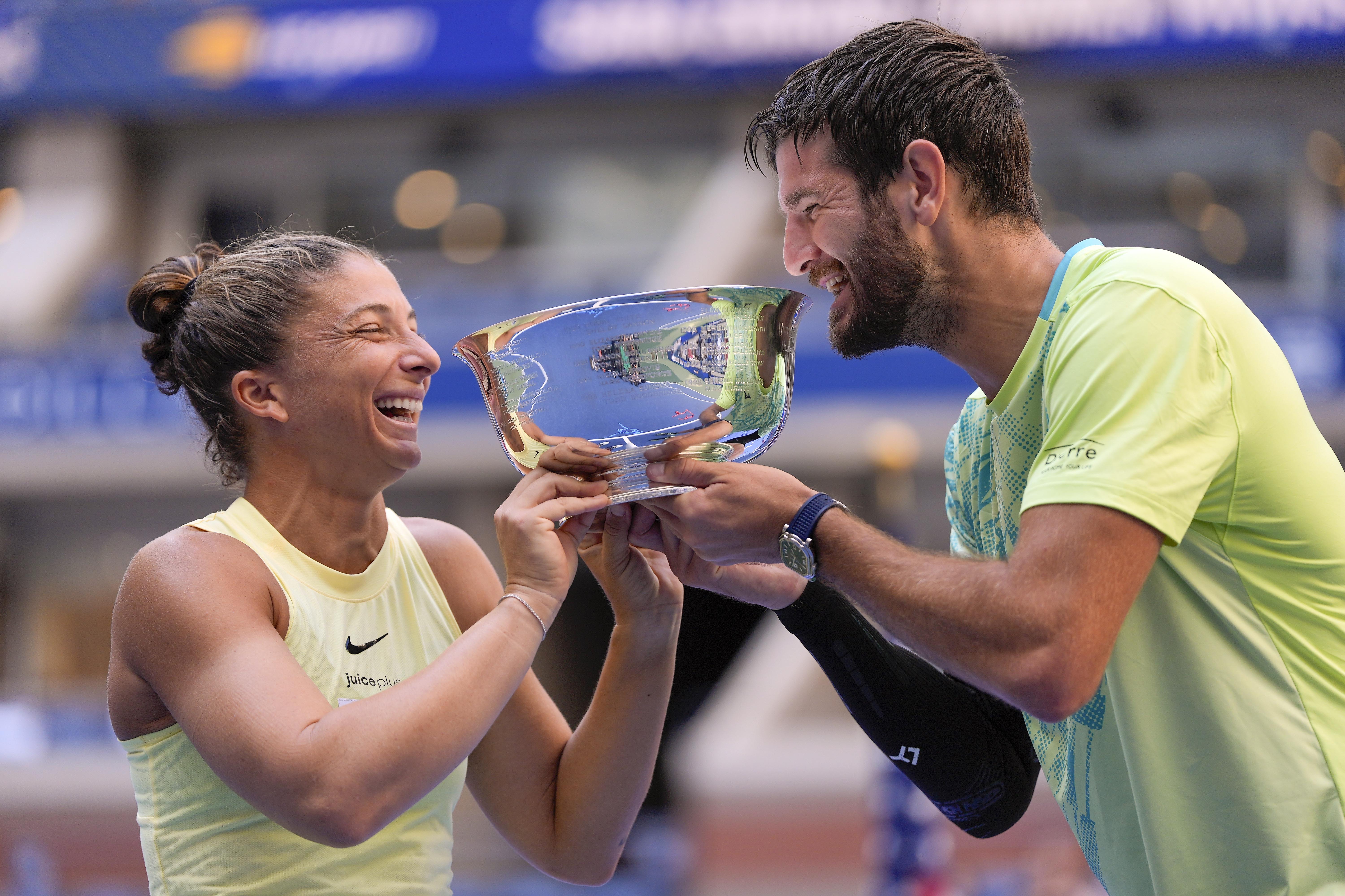 FILE - Sara Errani, of Italy, and Andrea Vavassori, of Italy, hold up the championship trophy after defeating Taylor Townsend, of the United States, and Donald Young, of the United States, in the mixed doubles final of the U.S. Open tennis championships Sept. 5, 2024, in New York.