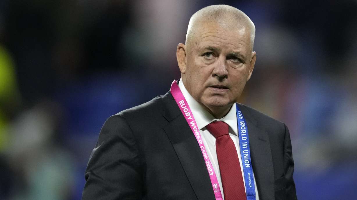 Wales' head coach Warren Gatland stands on the pitch as his players warm-up before the Rugby World Cup Pool C match between Wales and Australia at the OL Stadium in Lyon, France, Sept. 24, 2023.