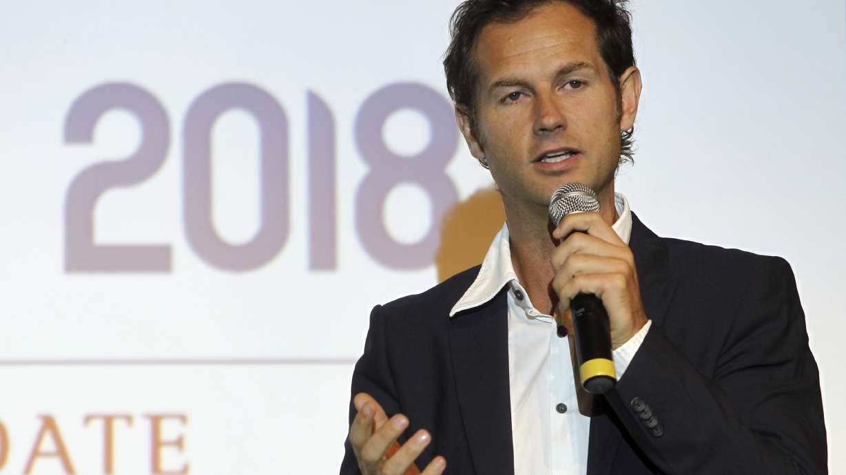 FILE - French Edgar Grospiron, former ski champion, during a press conference in Paris, on Oct. 4, 2010. Edgar Grospiron, the moguls Olympic champion in Albertville in 1992, is bidding to become president of the organising committee for the 2030 Winter Olympics in France.