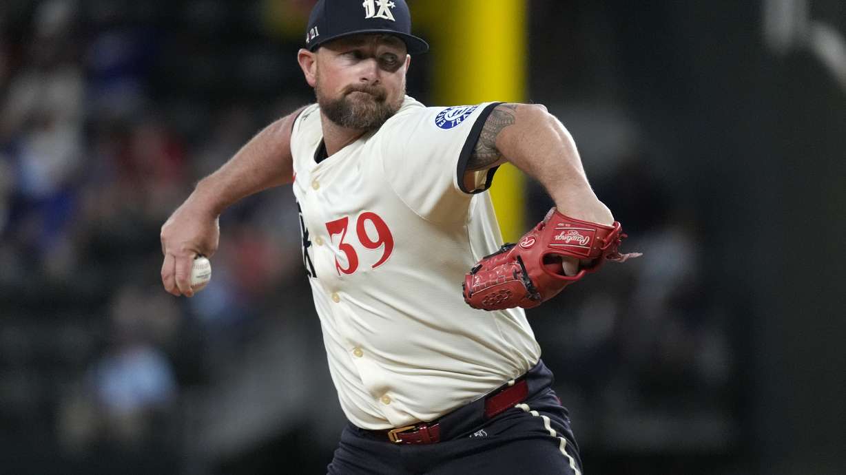 FILE - Texas Rangers closing pitcher Kirby Yates throws during the ninth inning of a baseball game agains the Tampa Bay Rays in Arlington, Texas, on July 5, 2024.