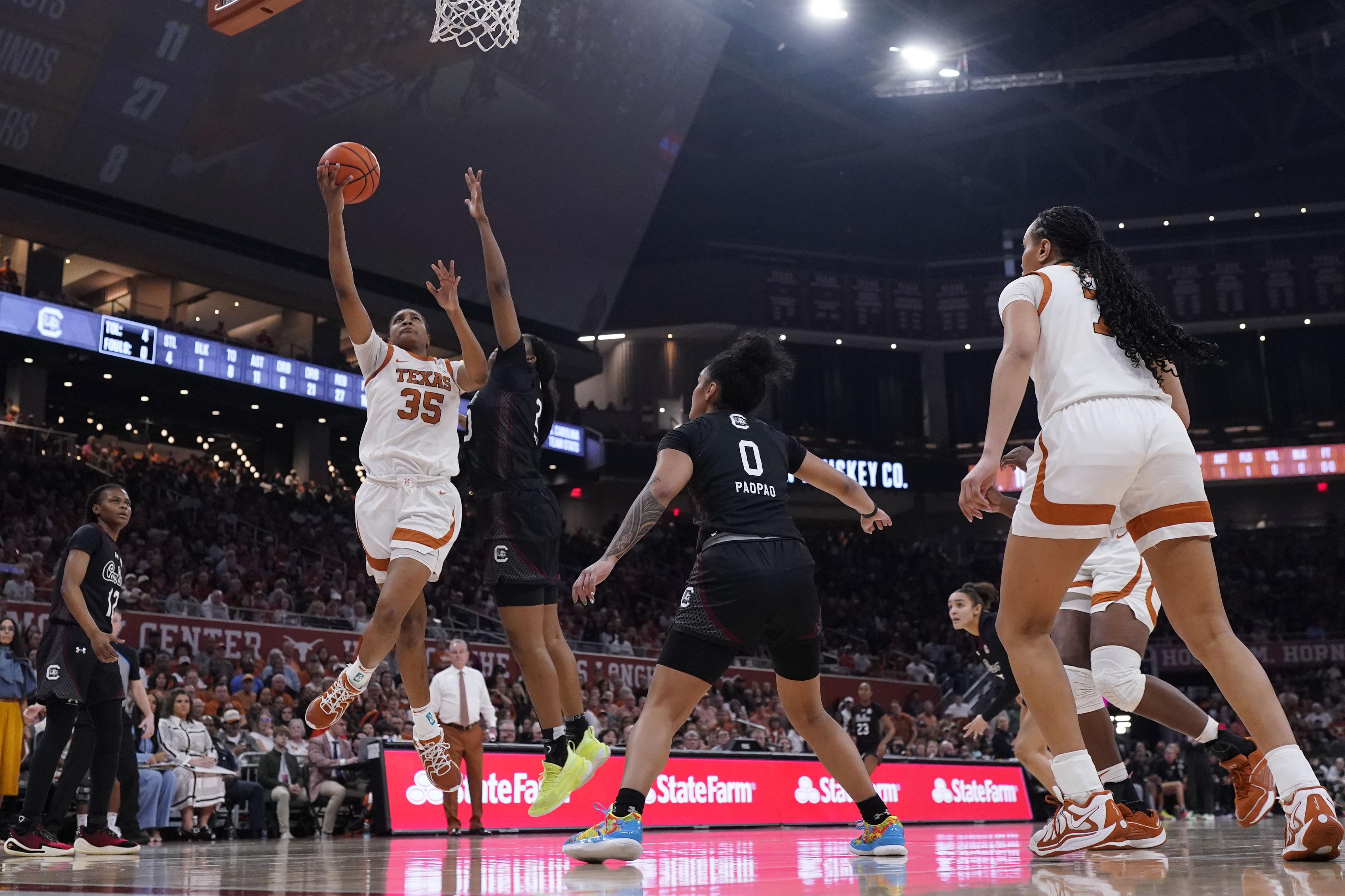 Texas forward Madison Booker (35) drives to the basket against South Carolina during the second half of an NCAA college basketball game in Austin, Texas, Sunday, Feb. 9, 2025.