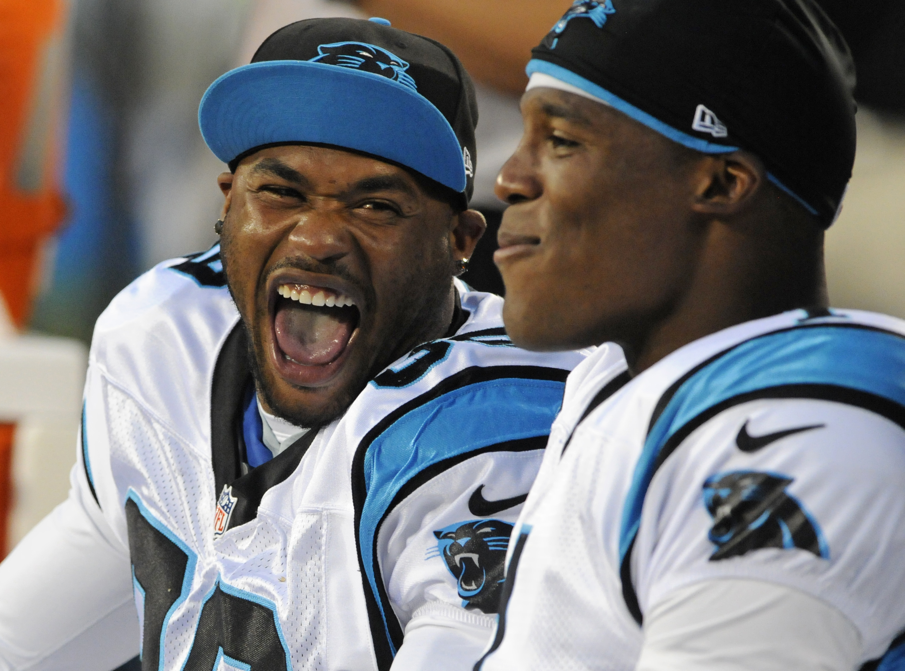 FILE - Carolina Panthers' Steve Smith, left, and Cam Newton, right, share a laugh during the first half of an NFL preseason football game against the Pittsburgh Steelers, Thursday, Aug. 29, 2013, in Charlotte, N.C.