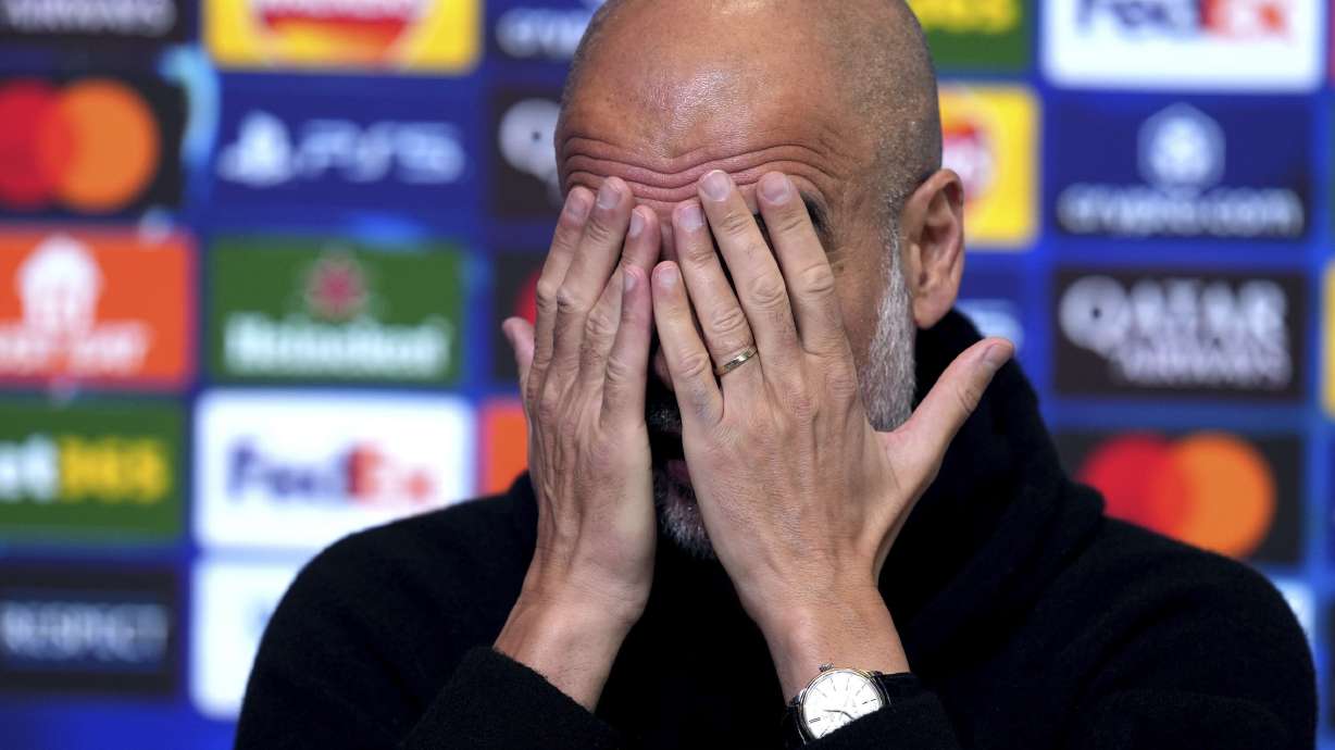 Manchester City manager Pep Guardiola gestures during a press conference at the City Football Academy, Manchester, England, Monday, Feb. 10, 2025.