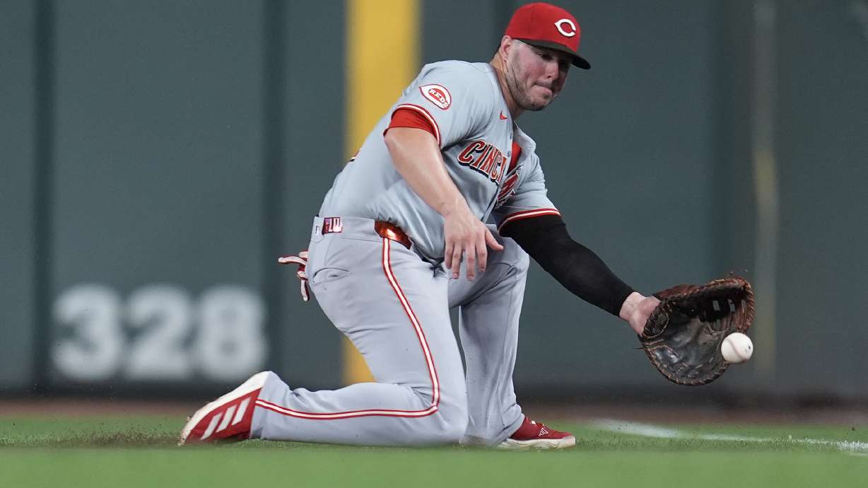 FILE - Cincinnati Reds first baseman Ty France (2) fields a groundout hit by Minnesota Twins' Brooks Lee during the sixth inning of a baseball game Saturday, Sept. 14, 2024, in Minneapolis.