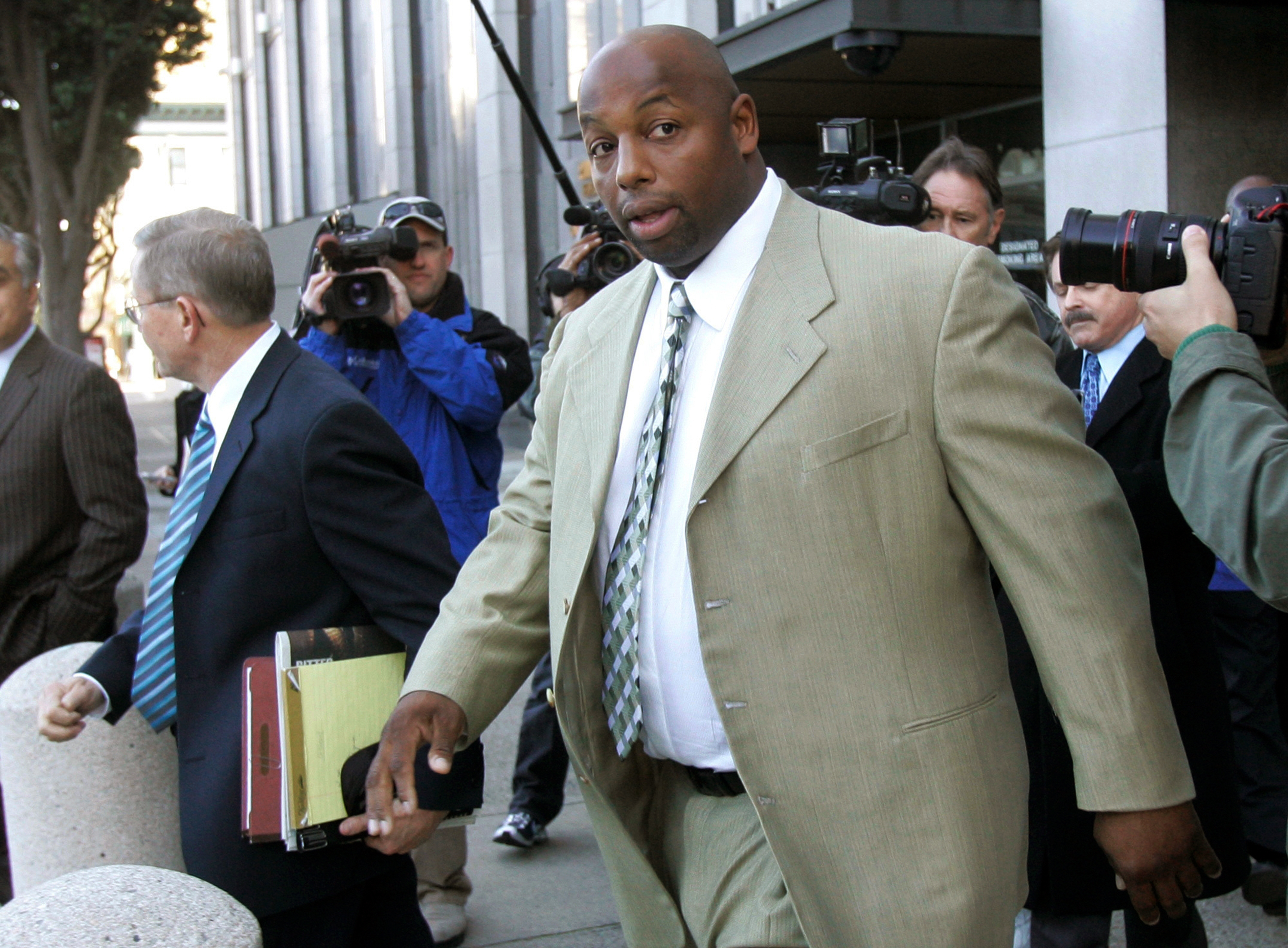 FILE - Former NFL football player Dana Stubblefield leaves a federal courthouse in San Francisco, Jan. 18, 2008. 