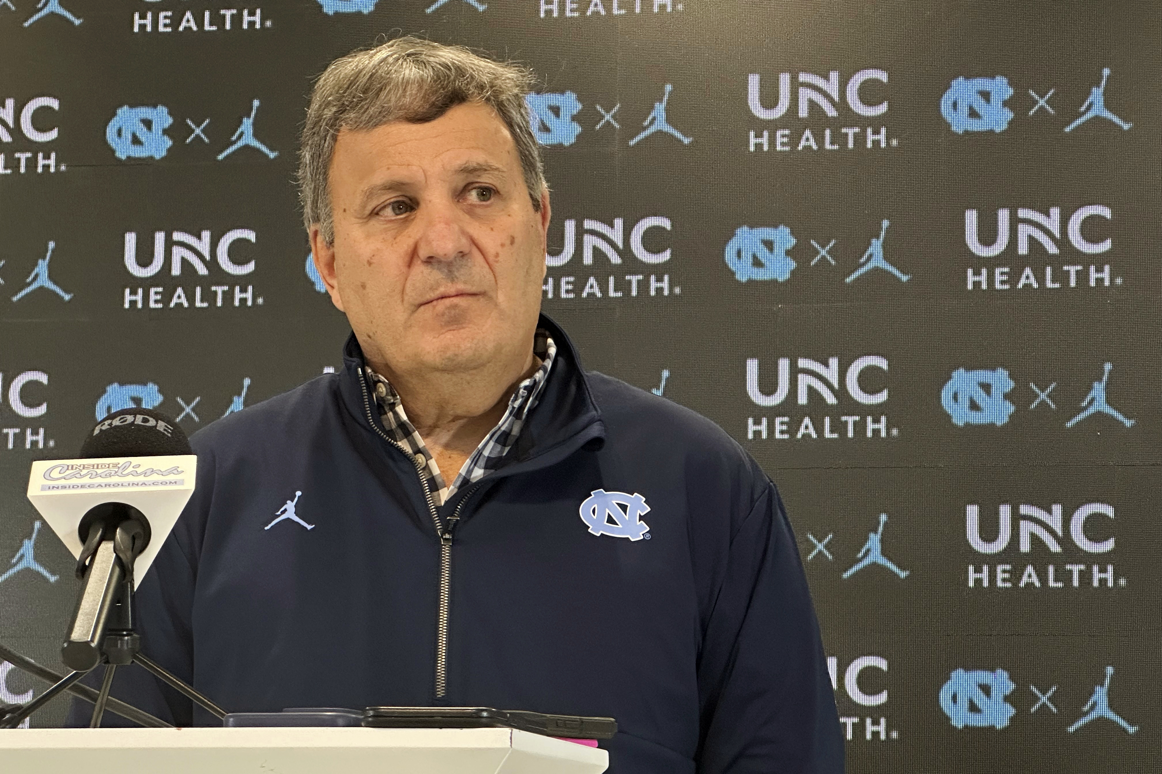 North Carolina general manager Michael Lombardi speaks with reporters during an NCAA college football news conference, Tuesday, Feb. 11, 2025, in Chapel Hill, N.C., about two months after the hiring of football coach Bill Belichick, 