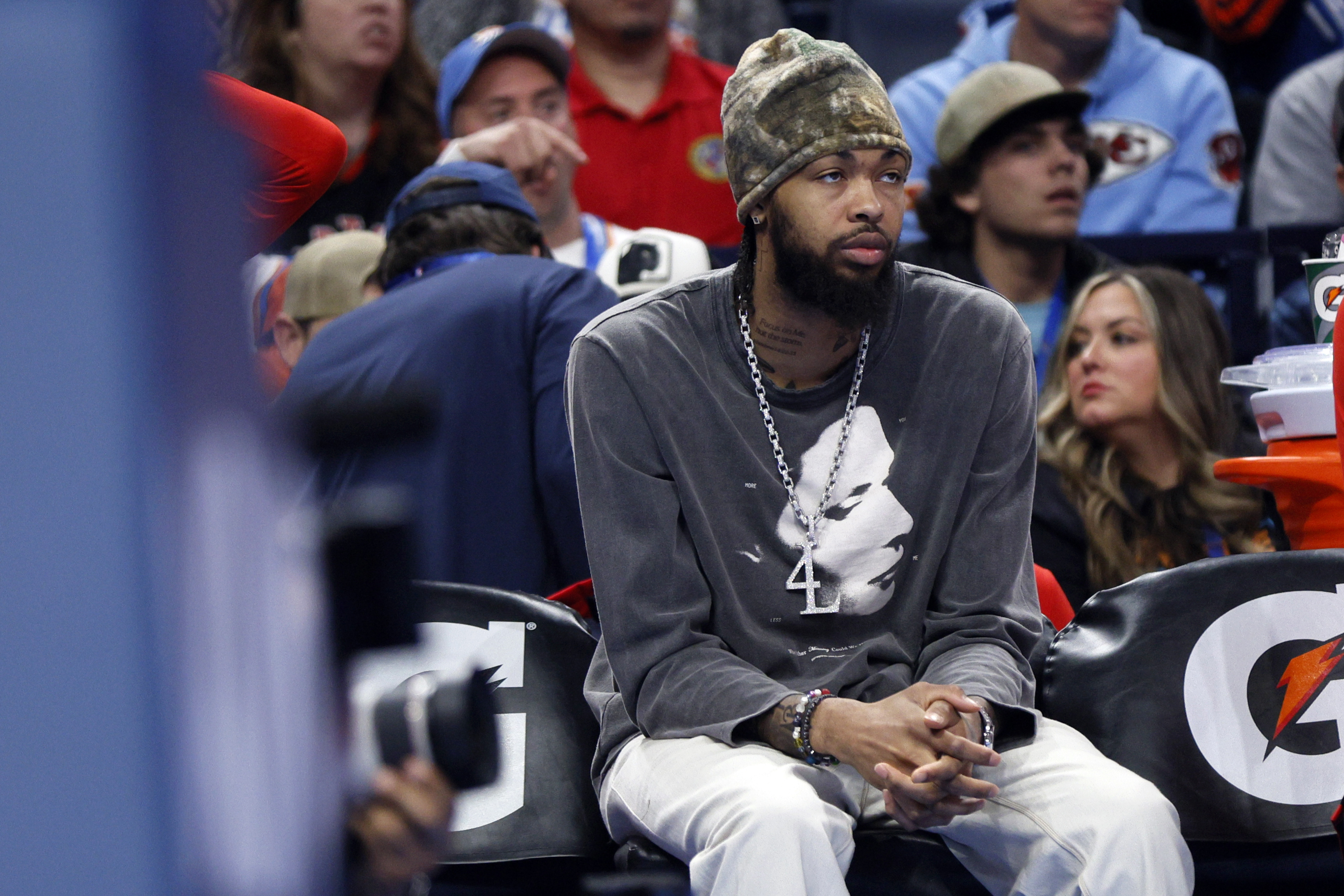 Injured Toronto Raptors forward Brandon Ingram watches from the bench during the first half of an NBA basketball game against the Oklahoma City Thunder, Friday, Feb. 7, 2025, in Oklahoma City.