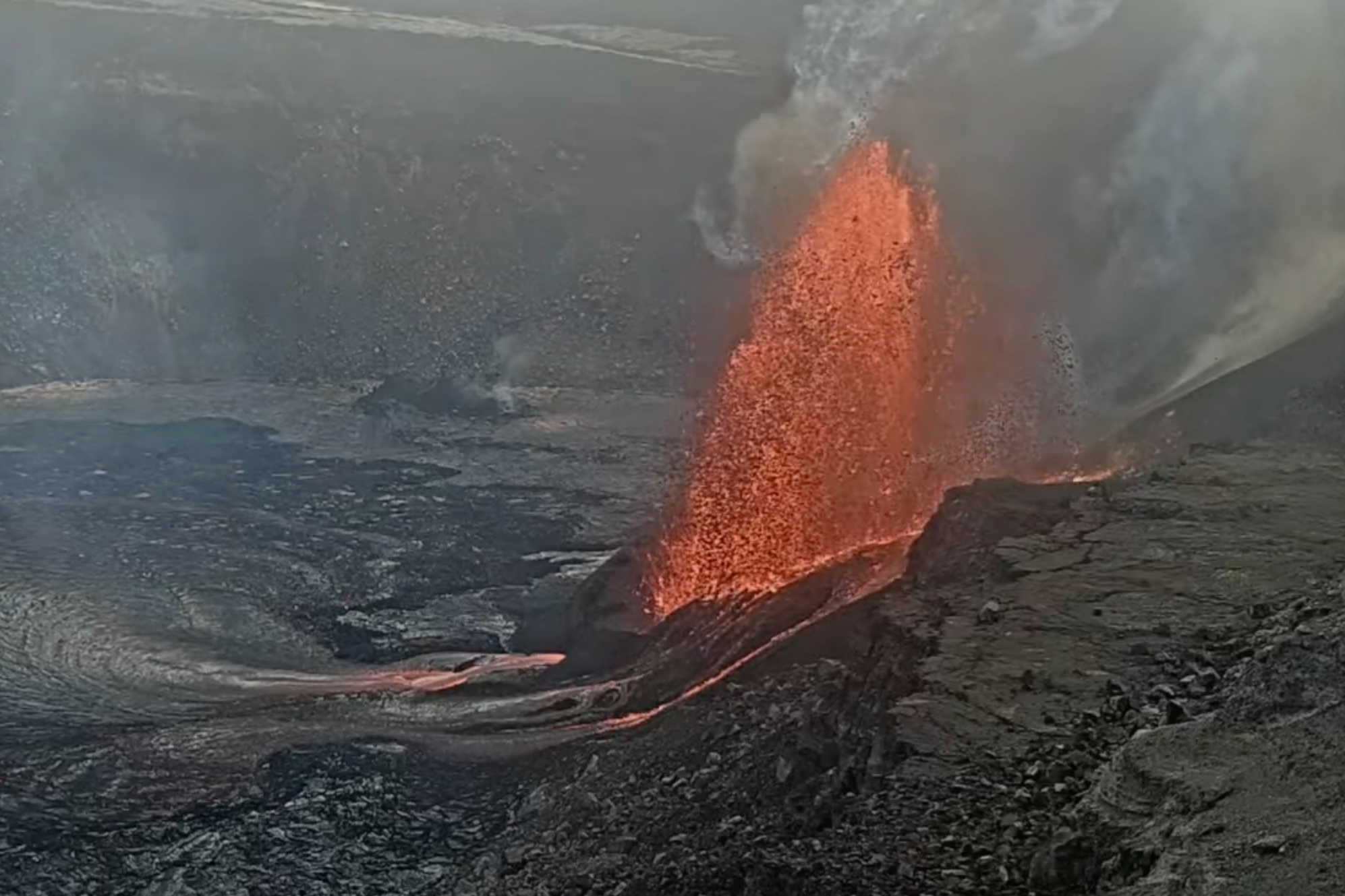 Lava erupts from Haleumaumau Crater at the summit of Kilauea volcano inside Hawaii Volcanoes National Park, Hawaii, on Tuesday.