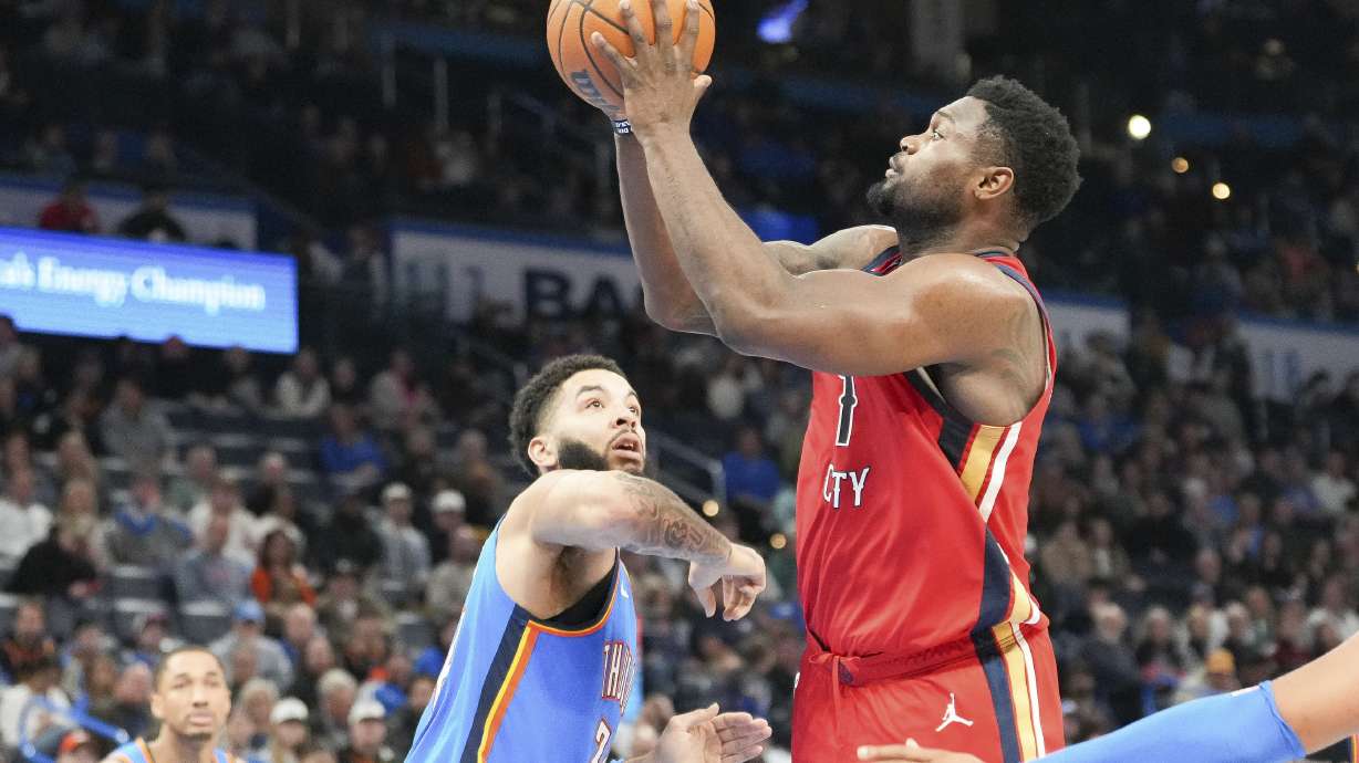 New Orleans Pelicans forward Zion Williamson, right, looks to shoot over OKlahoma City Thunder forward Kenrich Williams, front left, during the second half of an NBA basketball game, Monday, Feb. 10, 2025, in Oklahoma City.