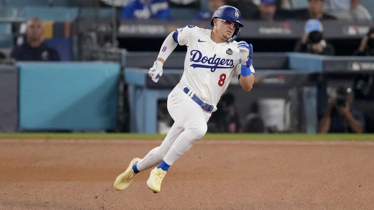 FILE - Los Angeles Dodgers' Kiké Hernández rounds second base on his way to a triple during the fifth inning in Game 1 of the baseball World Series against the New York Yankees, Oct. 25, 2024, in Los Angeles.