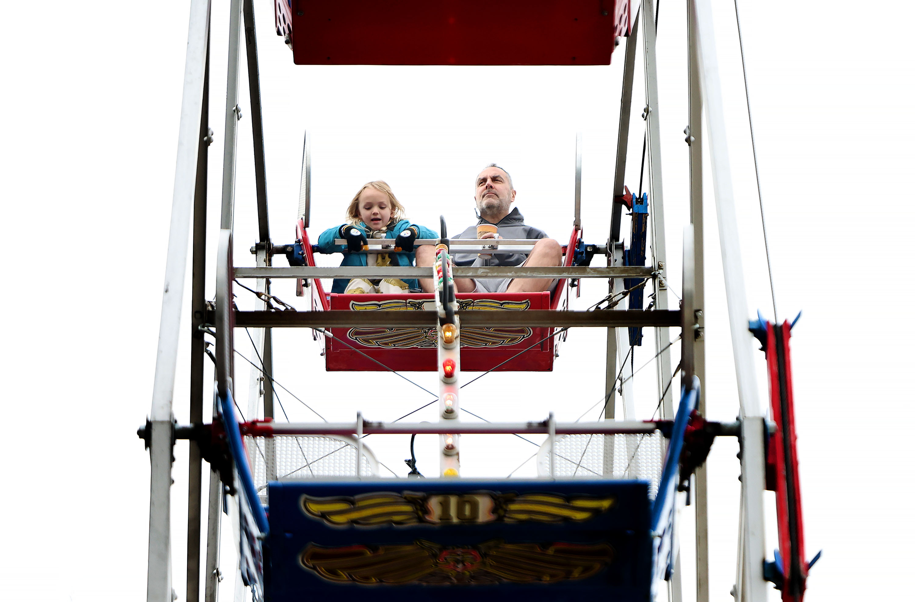 Sonny Jarvis, 5, of Heber, and his grandfather, Dan Del Porto, of Salt Lake City, ride the Ferris wheel at Liberty Park in Salt Lake City on Jan. 3.