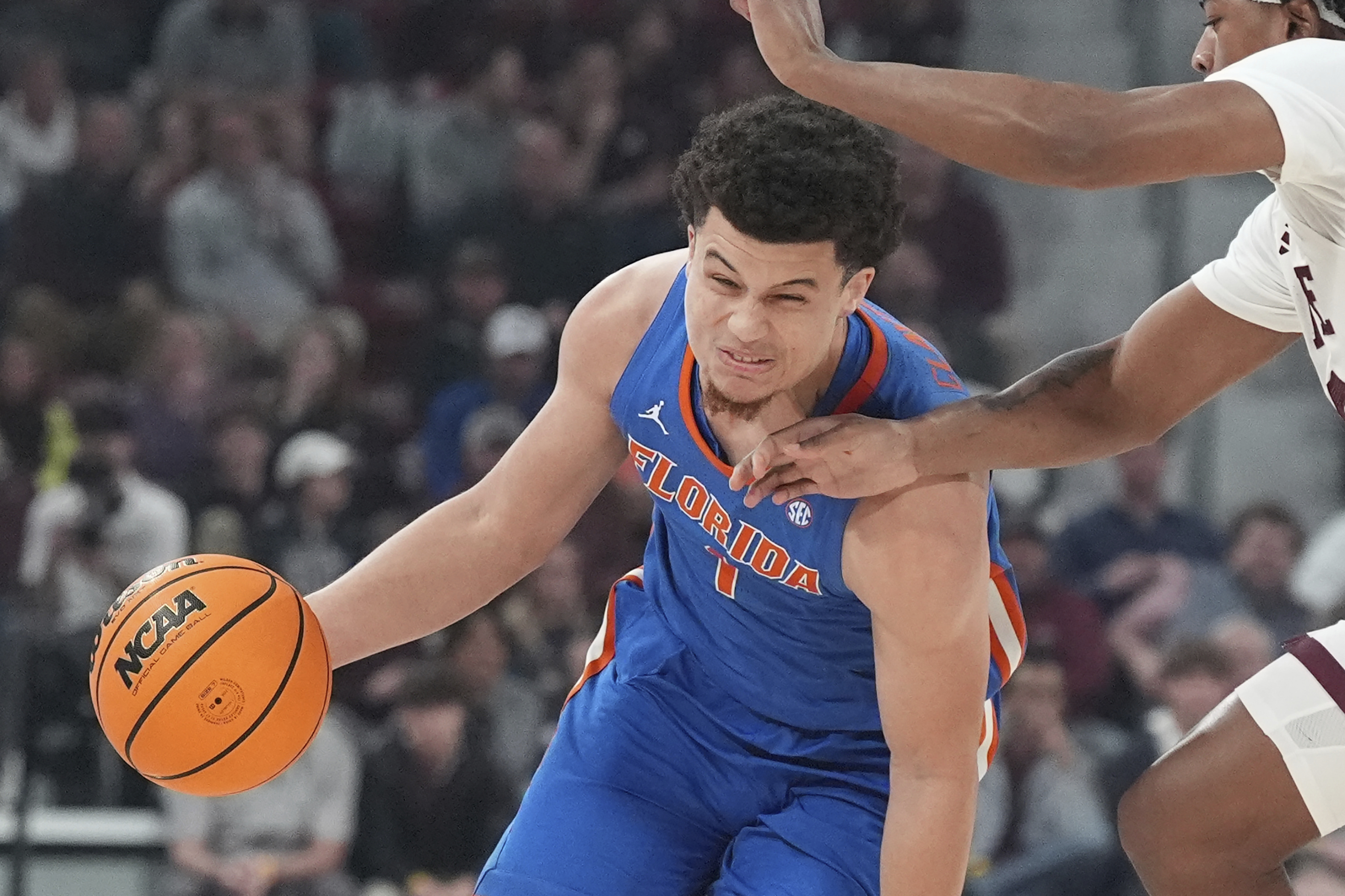 Florida guard Walter Clayton Jr. (1) runs into the hands of a Mississippi State defender during the first half of an NCAA college basketball game, Wednesday, Feb. 11, 2025, in Starkville, Miss. 
