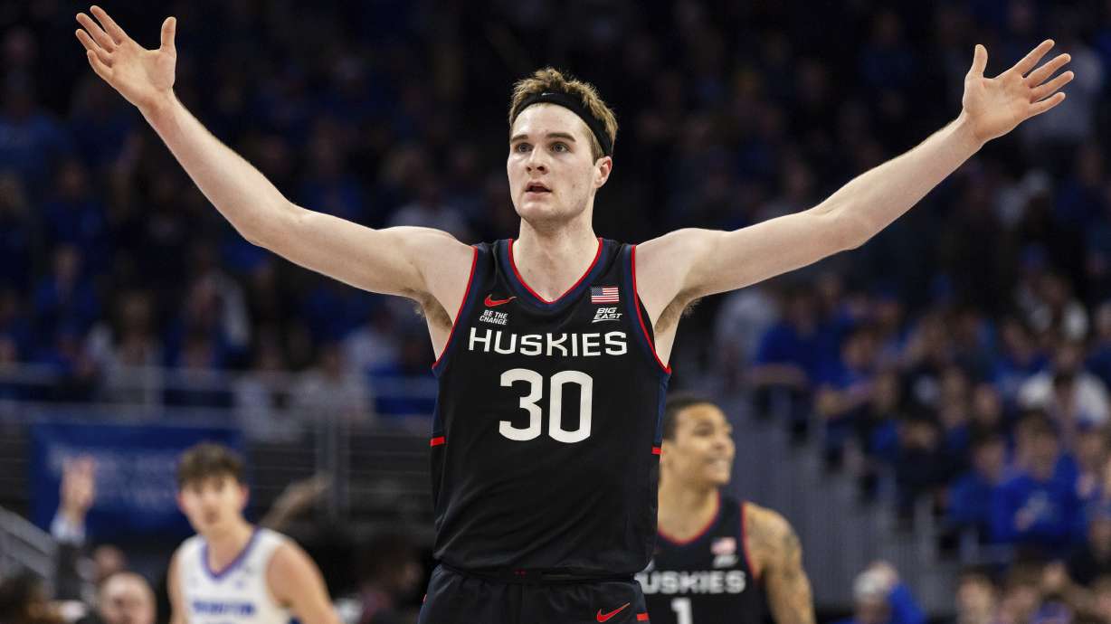 UConn forward Liam McNeeley (30) celebrates during the second half of an NCAA college basketball game against Creighton, Tuesday, Feb. 11, 2025, in Omaha, Neb.