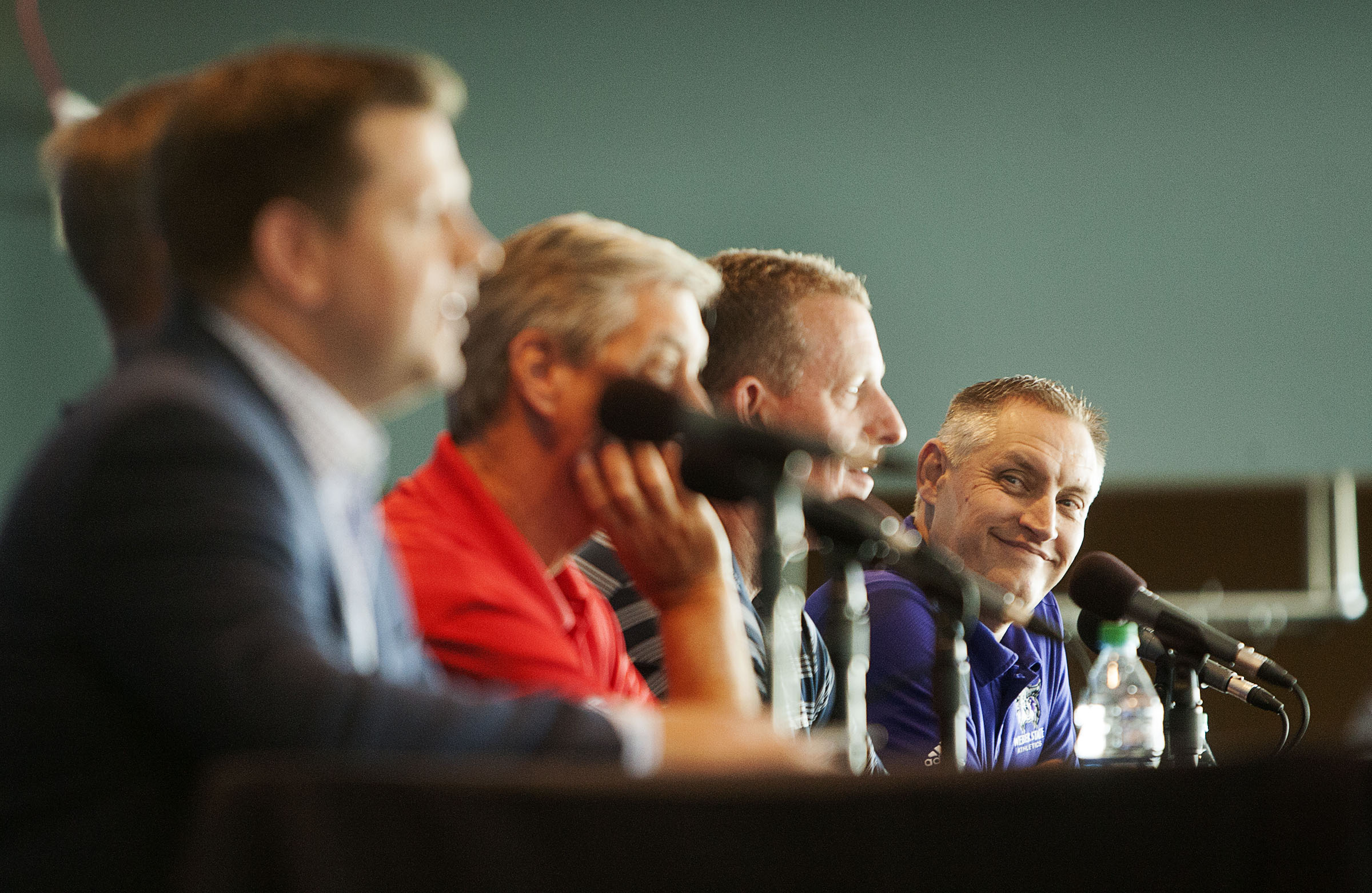 Jerry Bovee, athletic director at Weber State University, right, smiles as Steve Starks, president of Larry H. Miller Sports and Entertainment comments at a media event announcing the Zion's Bank Beehive Classic at the Vivint Arena in Salt Lake City, Thursday, July 21, 2016.