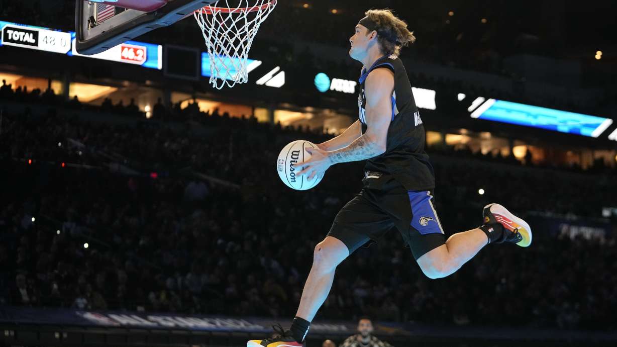 FILE - Osceola Magic's Mac McClung dunks during the slam dunk competition at the NBA basketball All-Star weekend, Saturday, Feb. 17, 2024, in Indianapolis.