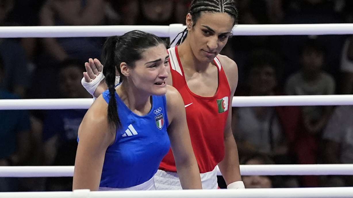 FILE - Algeria's Imane Khelif, right, looks at Italy's Angela Carini, following their women's 66kg preliminary boxing match at the 2024 Summer Olympics, Thursday, Aug. 1, 2024, in Paris, France.