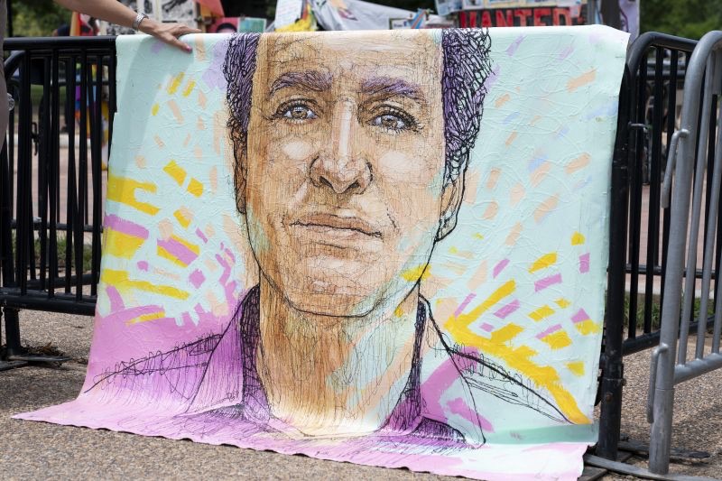 A drawn portrait of Marc Fogel, who had been detained in Russia since August 2021, hangs on rails outside of the White House during a demonstration organized by his family, July 15, 2023, in Washington. Russia said on Wednesday that a Russian citizen was freed from a U.S. prison in exchange for Moscow's release of Fogel.