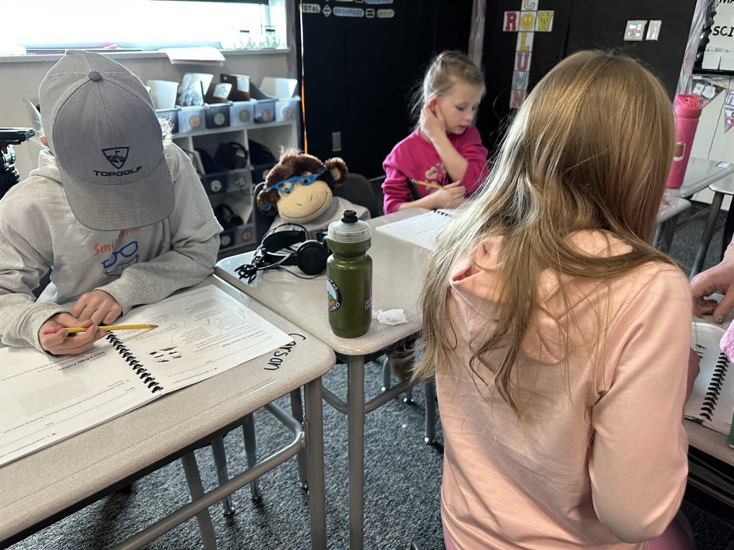 George, the monkey, learns with Lucas' classmates on Tuesday in West Jordan. The monkey was instituted as Lucas battles leukemia and often misses class.