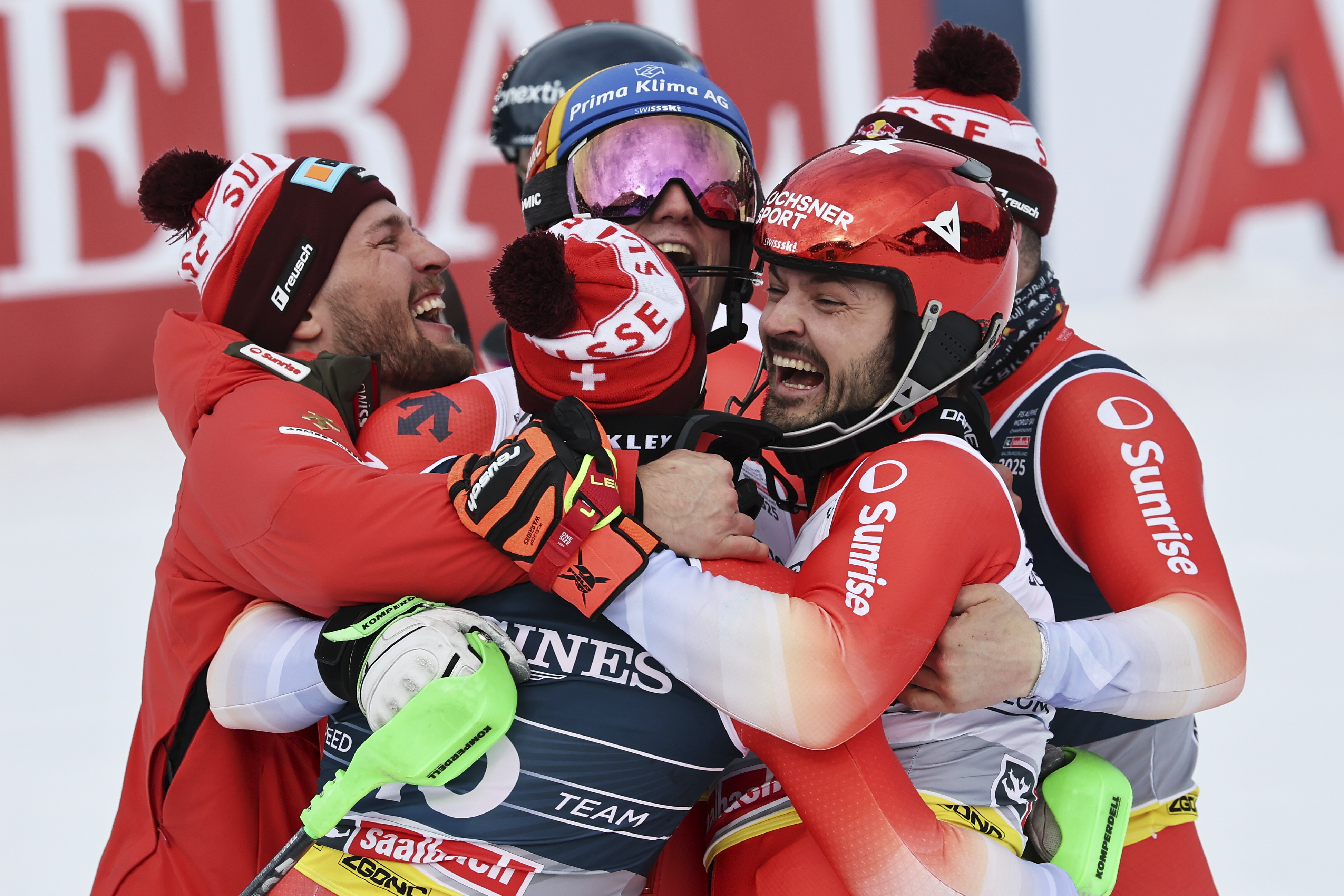 Clockwise from left, Switzerland's Alexis Monney, Stefan Rogentin, Loic Meillard, Marc Rochat and Nef Tanguy celebrate at the finish area of a men's team combined event, at the Alpine Ski World Championships, in Saalbach-Hinterglemm, Austria, Wednesday, Feb. 12, 2025. 