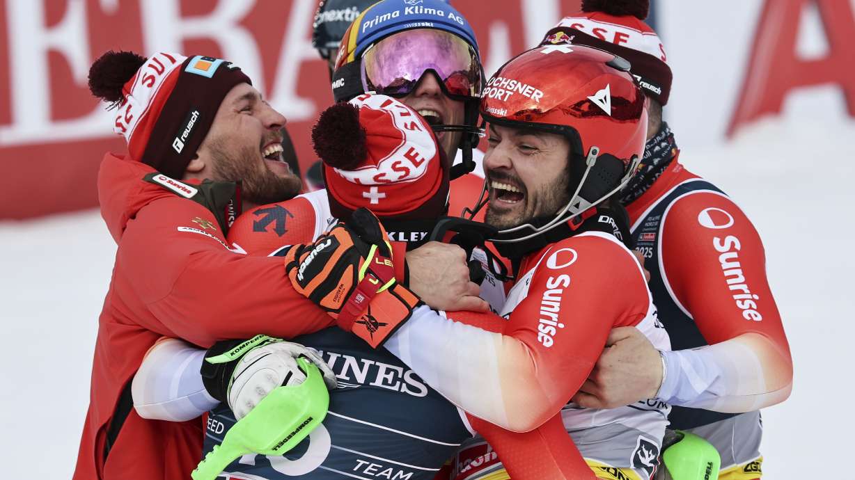 Clockwise from left, Switzerland's Alexis Monney, Stefan Rogentin, Loic Meillard, Marc Rochat and Nef Tanguy celebrate at the finish area of a men's team combined event, at the Alpine Ski World Championships, in Saalbach-Hinterglemm, Austria, Wednesday, Feb. 12, 2025.
