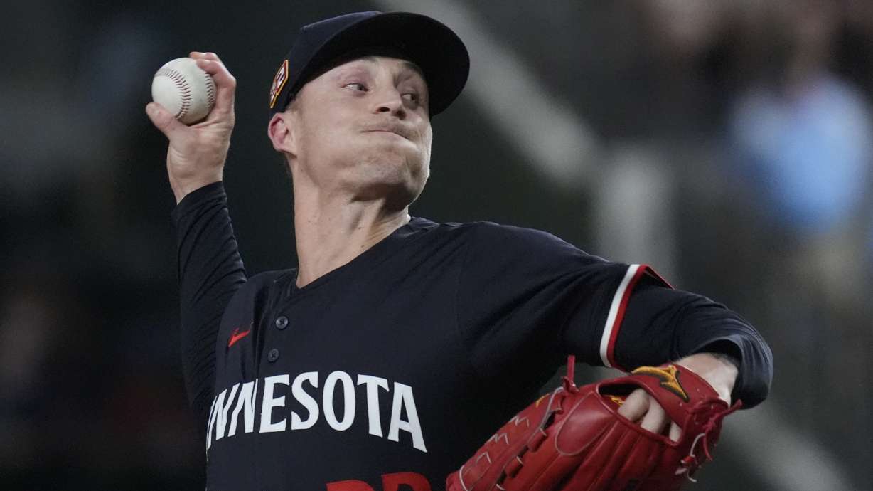 FILE - Minnesota Twins pitcher Griffin Jax throws during a baseball game against the Texas Rangers in Arlington, Texas, Aug. 16, 2024.