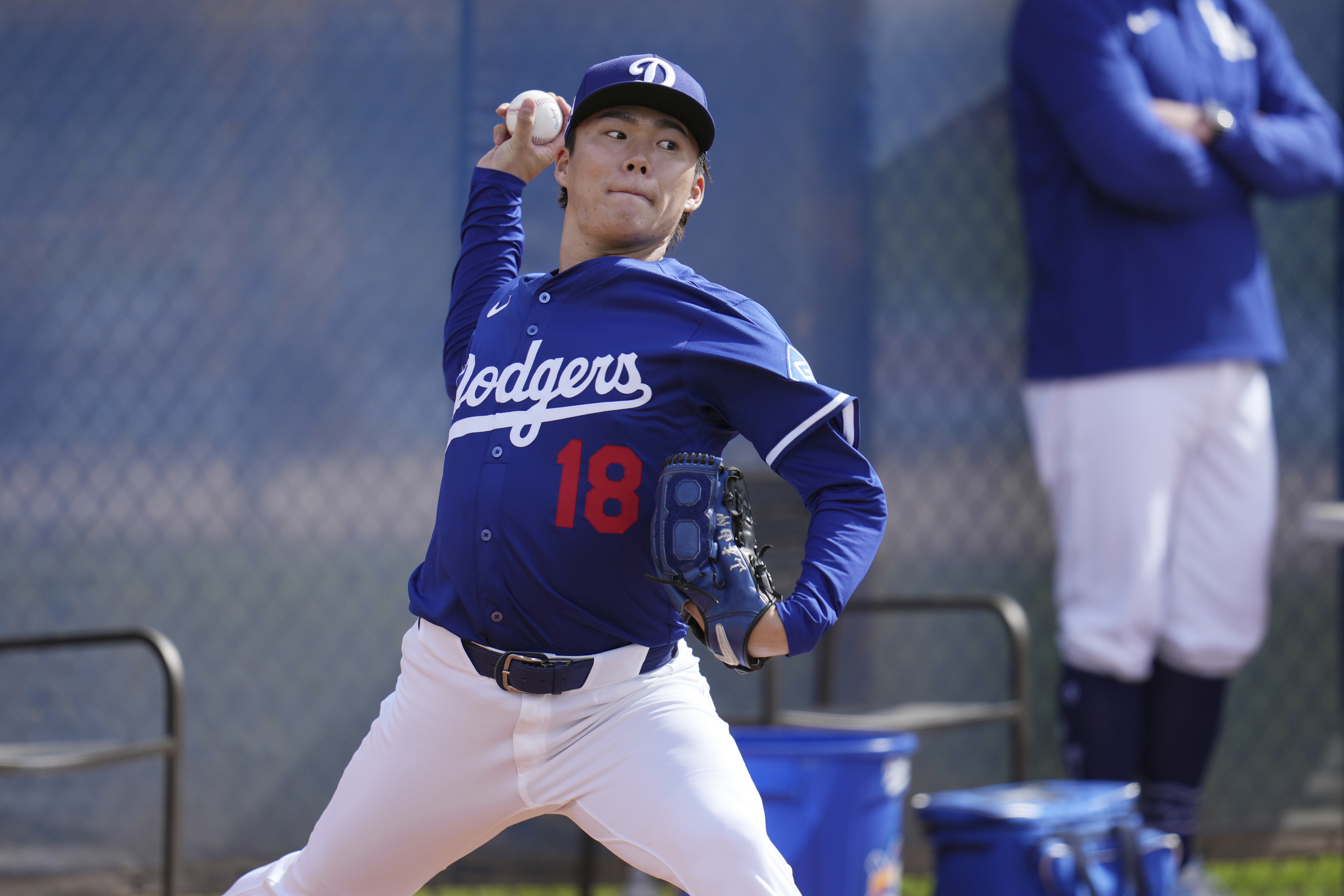 Los Angeles Dodgers pitcher Yoshinobu Yamamoto, of Japan, throws during a pitching session at the Dodgers baseball spring training facility, Tuesday, Feb. 11, 2025, in Phoenix.