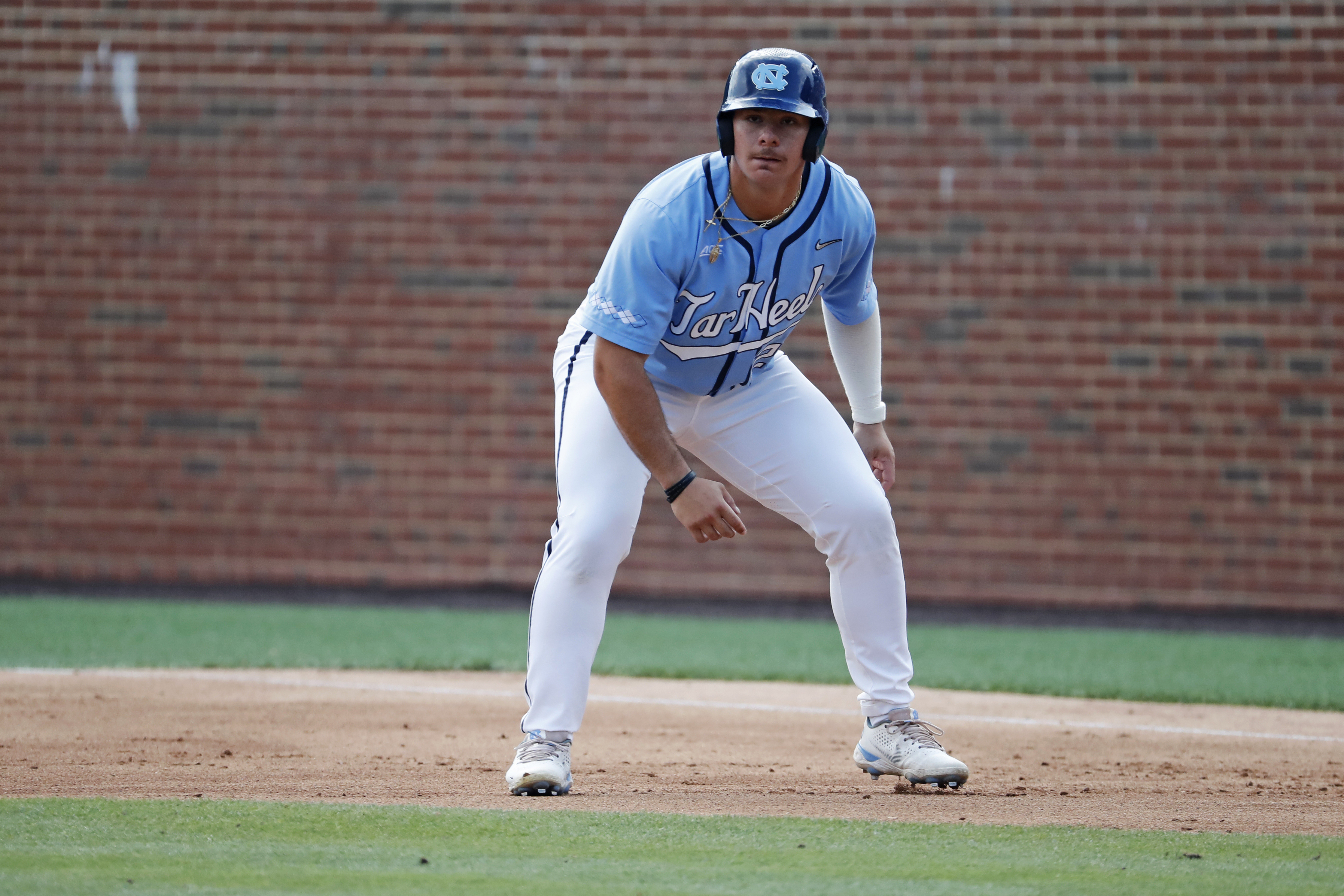 FILE - North Carolina's Alberto Osuna leads off first base during the second inning against Arkansas in an NCAA college super regional baseball game in Chapel Hill, N.C., June 12, 2022.