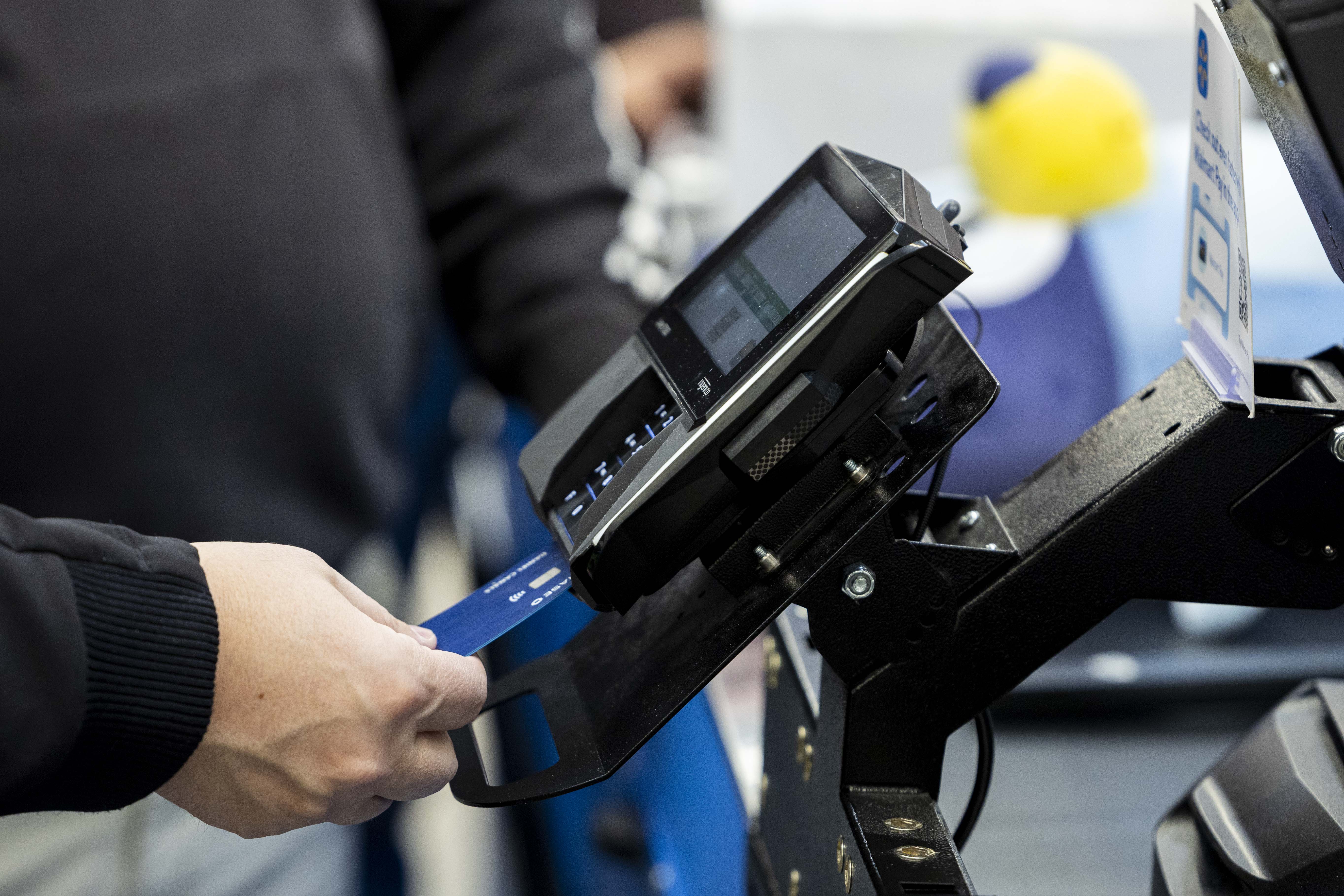 A shopper pays with a credit card at the South Jordan Parkway Walmart on Dec. 7, 2024. While 2025 is still in its infancy, economist Lindsey Piegza provided a look at what consumers can expect throughout the rest of the year.