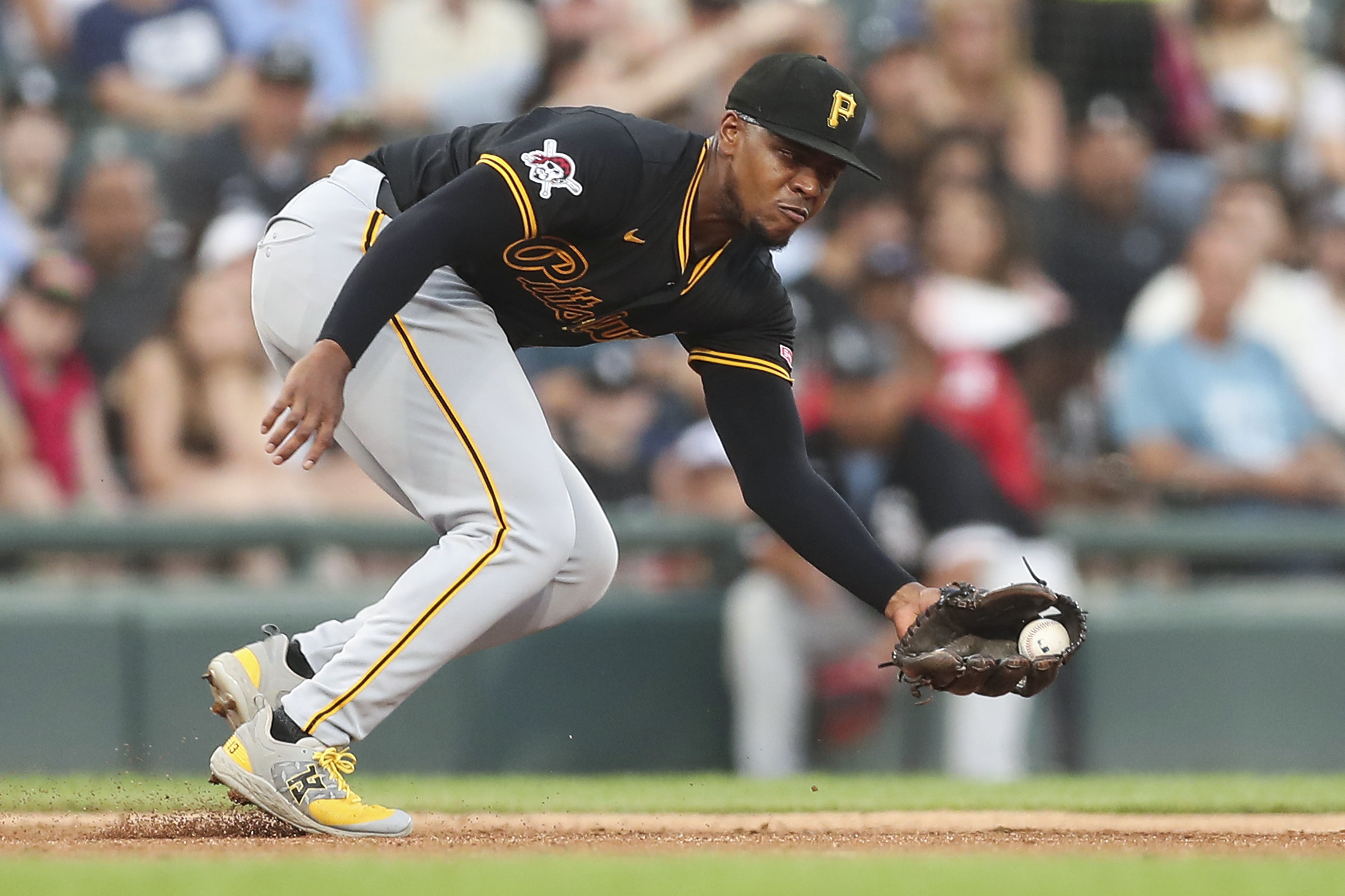 FILE - Pittsburgh Pirates' Ke'Bryan Hayes fields the ball during the third inning of a baseball game against the Chicago White Sox, in Chicago, July 12, 2024.