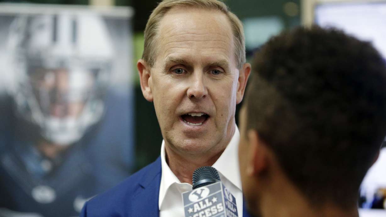 FILE - BYU athletic director Tom Holmoe speaks to a reporter Thursday, June 30, 2016, in Provo, Utah..