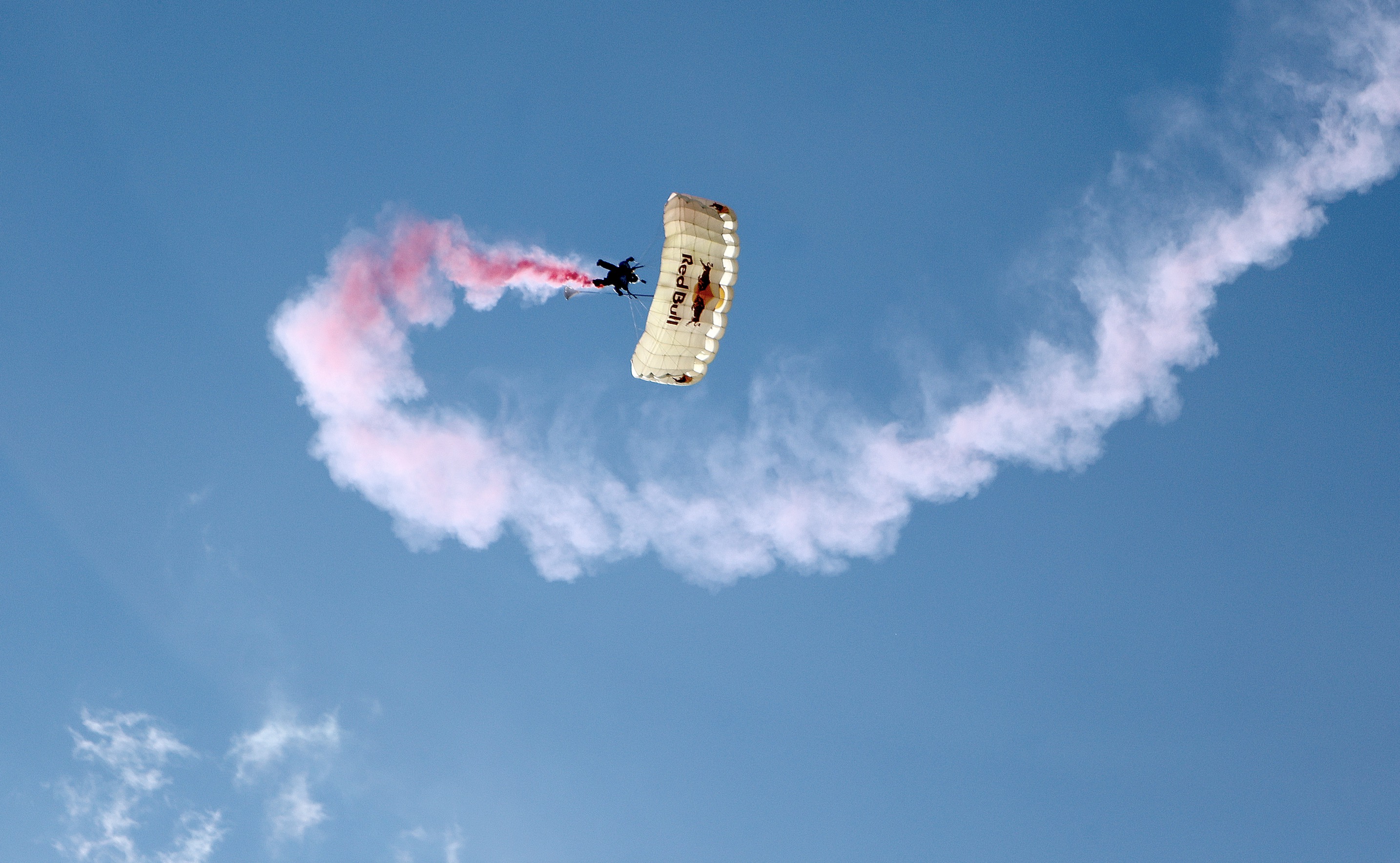 A Red Bull Air Force skydiver approaches the Utah Capitol grounds during a press conference to announce the debut of the Red Bull Soapbox Race Utah in Salt Lake City on Wednesday. The race will take place at the Capitol on June 14.