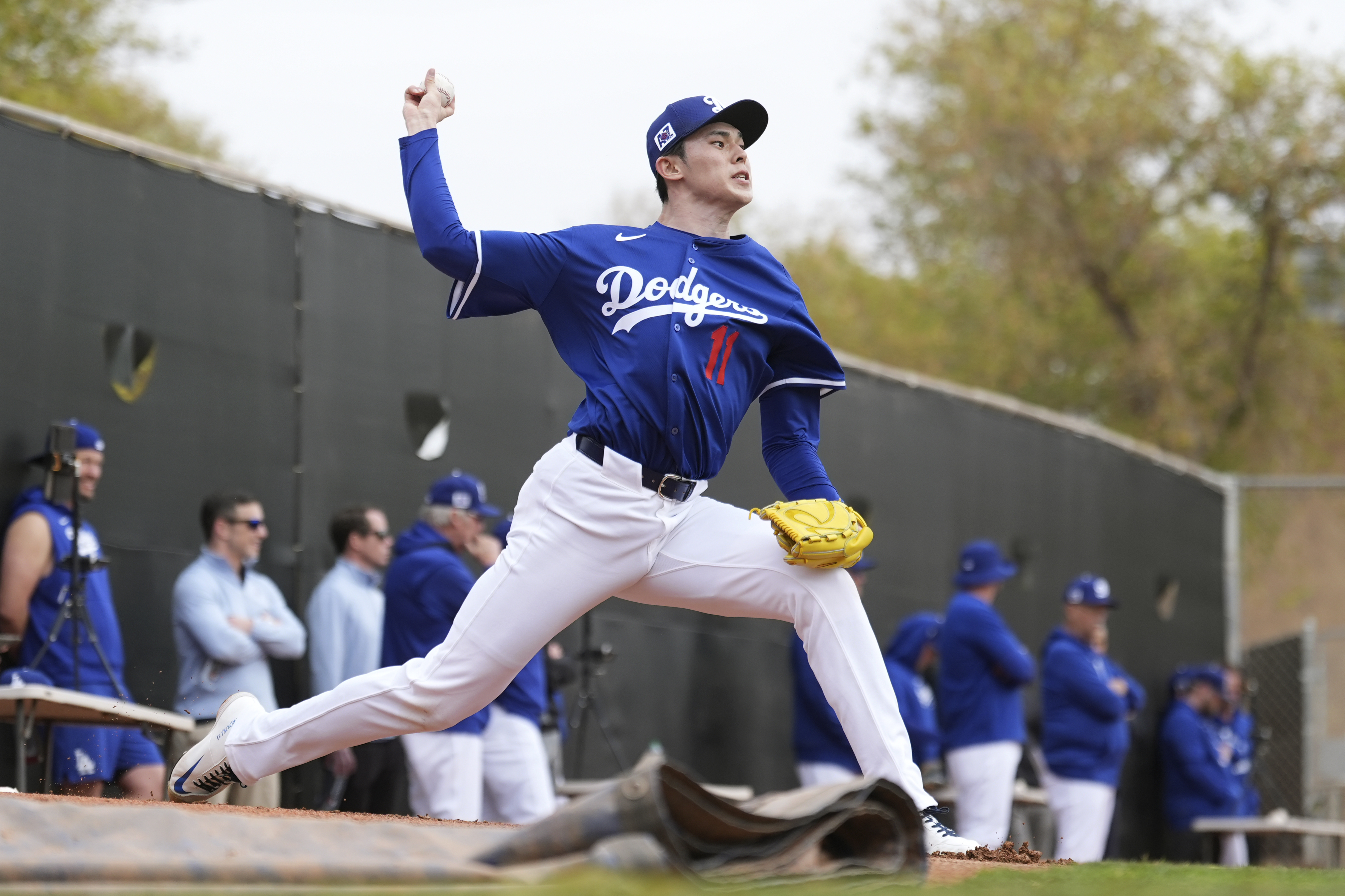 Los Angeles Dodgers pitcher Roki Sasaki, of Japan, throws during a pitching session at the team's baseball spring training facility Wednesday, Feb. 12, 2025, in Phoenix.