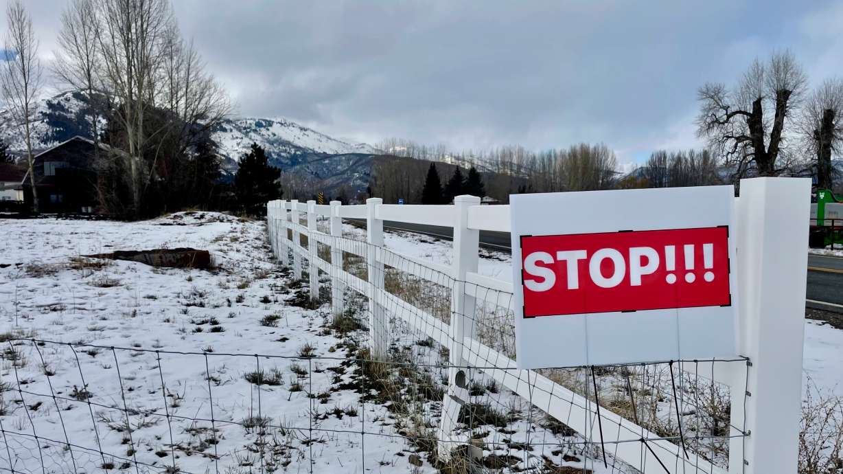 A sign in the Ogden Valley reading "STOP!!!" serves as a protest against Weber County leaders' moves to aid the Nordic Valley ski village proposal. The photo was taken Feb. 9, 2025, and the lawsuit centered on the dispute was dismissed Jan. 8.