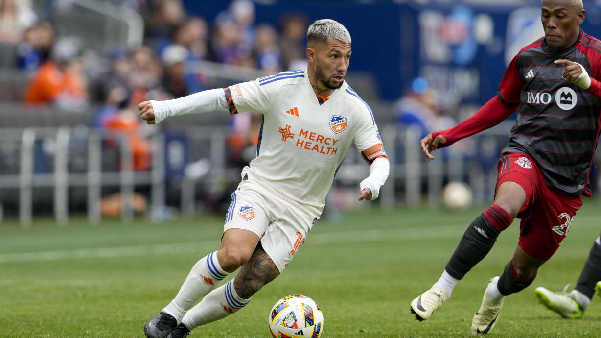 FILE - FC Cincinnati midfielder Luciano Acosta (10) controls the ball against Toronto FC midfielder Deybi Flores (20) during an MLS soccer match, Feb. 25, 2024, in Cincinnati.