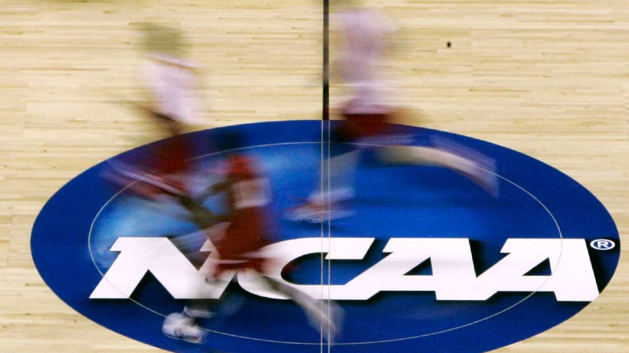 Louisville players run across the court during basketball practice at the NCAA East Regional on March 26, 2008. President Donald Trump's Department of Education on Wednesday revoked Biden-era guidance that universities must equitably distribute direct payments to male and female athletes.
