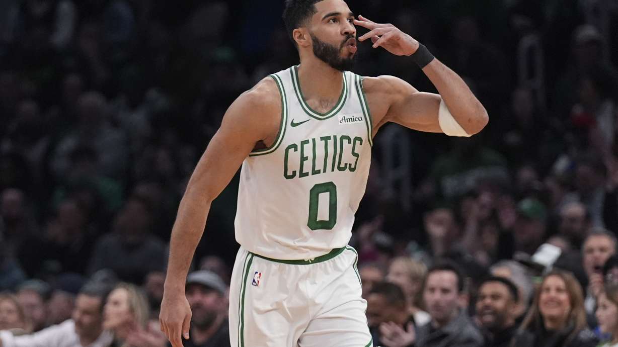 Boston Celtics forward Jayson Tatum blows a kiss after hitting a 3-pointer against the San Antonio Spurs during the first half of an NBA basketball game, Wednesday, Feb. 12, 2025, in Boston.