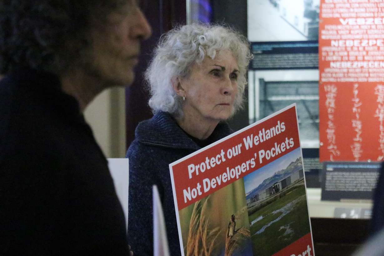 A demonstrator protests against the Utah Inland Port Authority at the State Capitol building Monday.