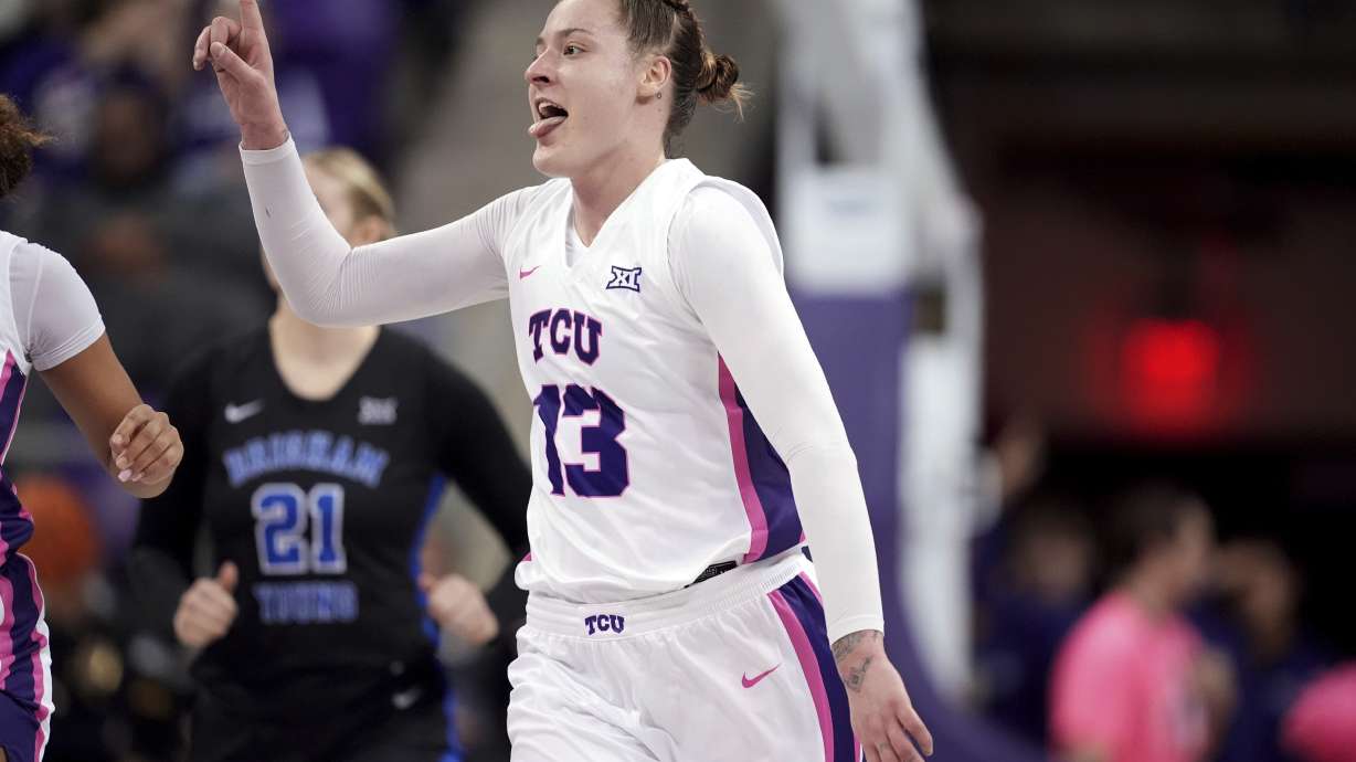 TCU's Sedona Prince (13) celebrates a basket by a teammate in the second half of an NCAA college basketball game against BYU in Fort Worth, Texas, Tuesday, Feb. 11, 2025.