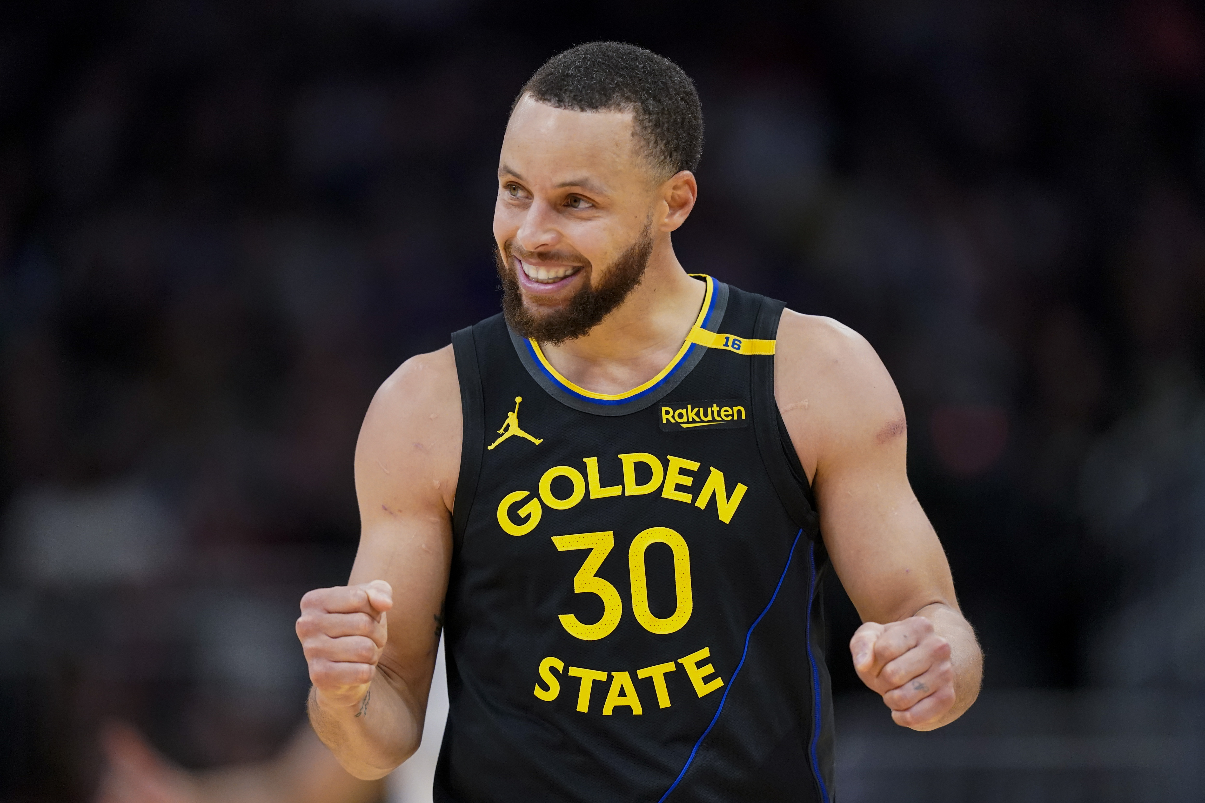 Golden State Warriors' Stephen Curry reacts during the second half of an NBA basketball game against the Milwaukee Bucks, Monday, Feb. 10, 2025, in Milwaukee.