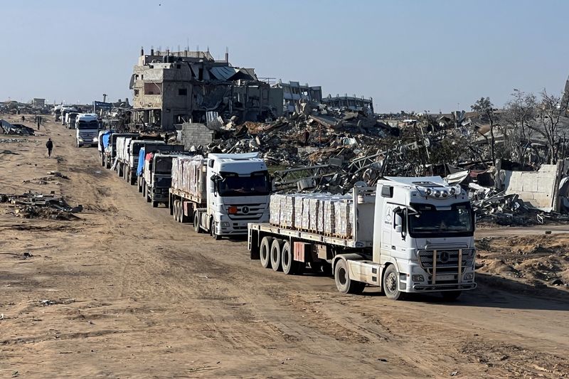 Trucks carrying aid move, amid a ceasefire between Israel and Hamas, in Rafah in the southern Gaza Strip, Thursday.