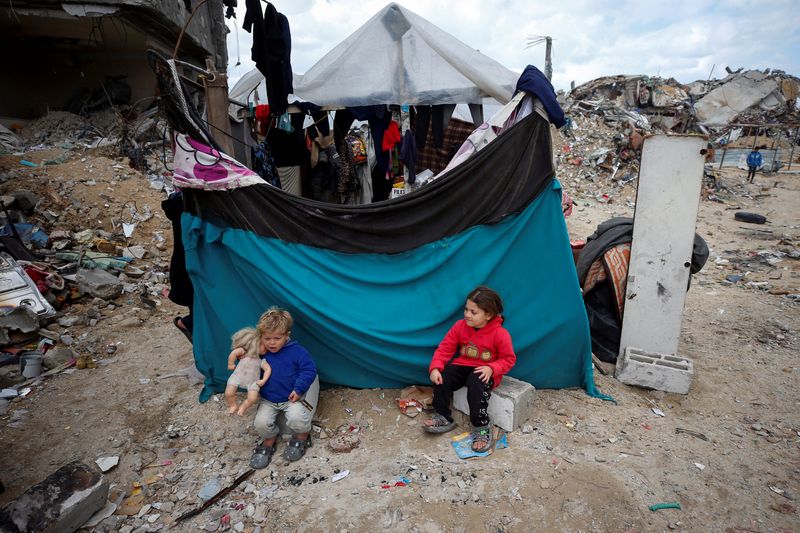 Palestinian children play near the rubble of their destroyed house, amid a ceasefire between Israel and Hamas, in Jabalia refugee camp in the northern Gaza Strip on Thursday.