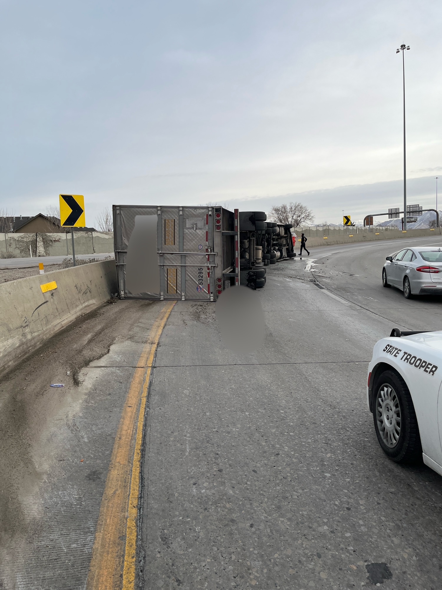 A semitruck rollover Thursday morning led to the driver being transported to a hospital with minor injuries and the closure of the ramp from I-215 westbound to I-15 southbound.