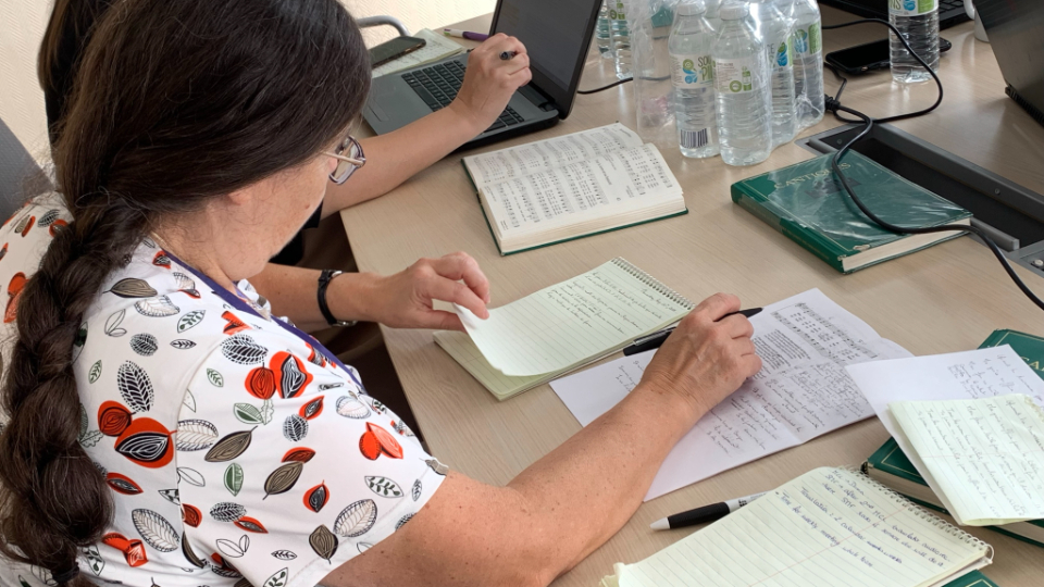 Members of the French translation team work on hymns for the new Latter-day Saint hymnbook in Versailles, France.